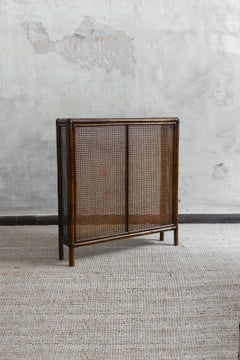 Radiator cover in bamboo and Vienna straw with leather bindings. Molto Editions