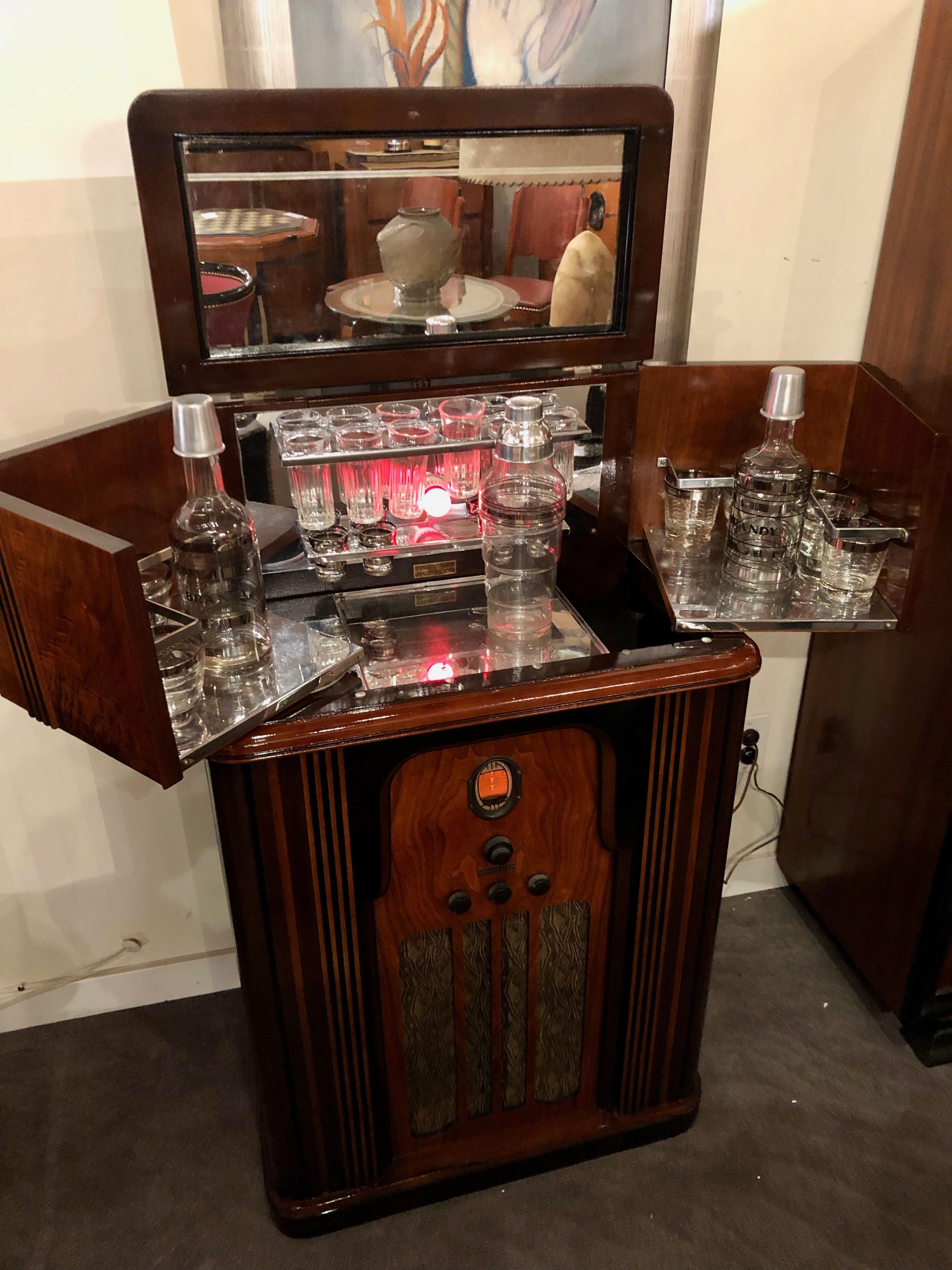 This spectacular Art Deco Philco Radio Bar is one of the most highly sought after pieces by radio and bar enthusiasts alike. Created originally during the Prohibition Era – a time of fascination with hidden and secret liquor bars, it reached a high