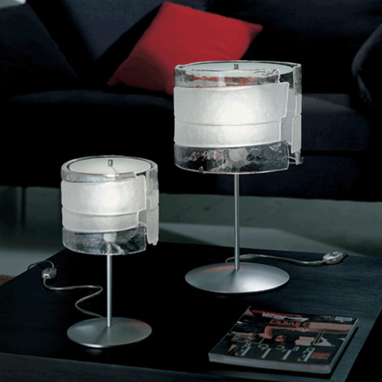 Radius RADTAMMD Table Lamp by Mazzega 1946
Dimensions: D 31 x H 50 cm.
Materials: Frame: Polished Chrome. 
Diffuser: Trasparent Crystal.
Weight: 7.5 Kg.

The roots of Mazzega1946 are in Murano, a land of master glassmakers who still today preserve