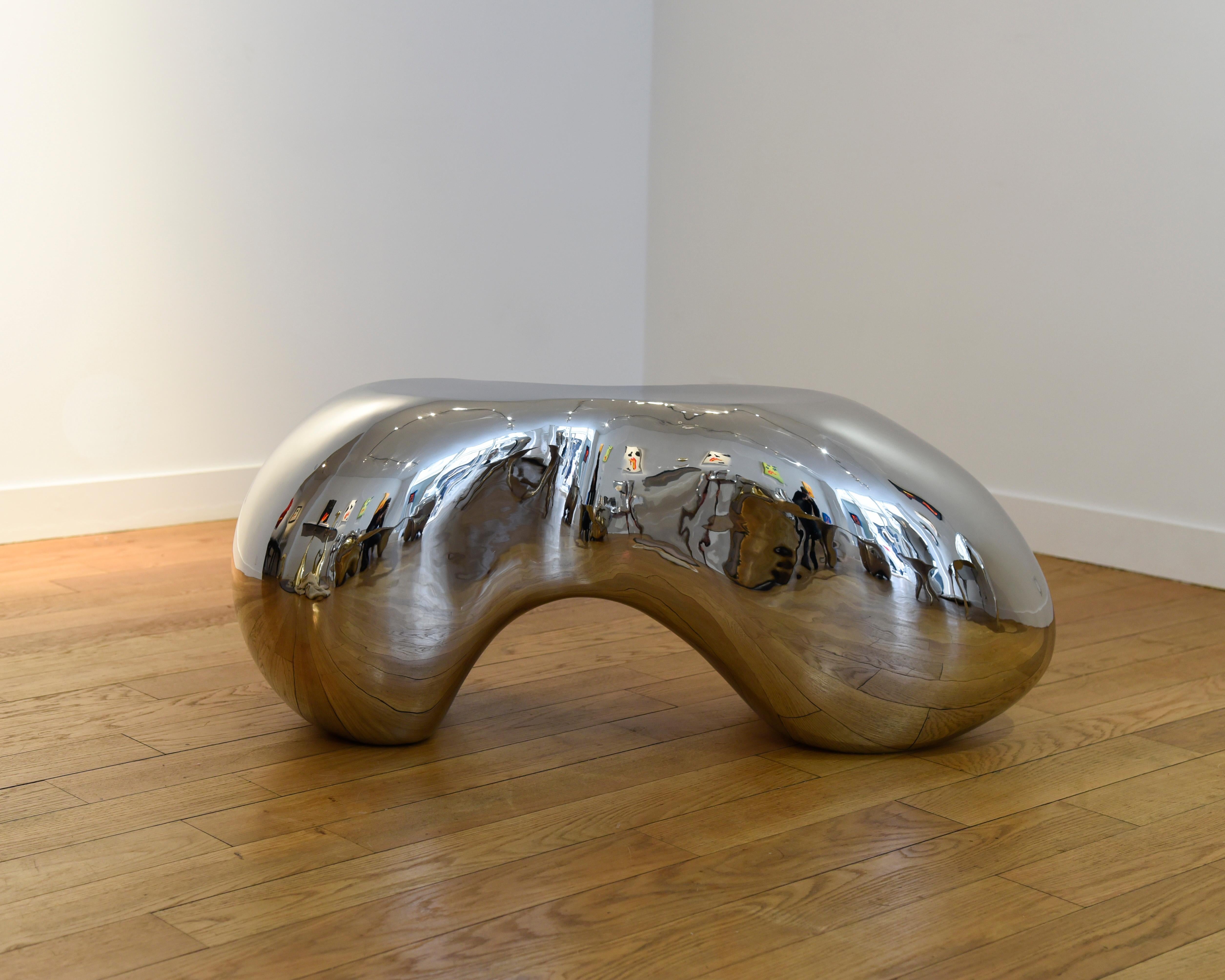 Collectible design Side or End table in mirror polished stainless steel. Radius is a free organic sculpture with soft and complex shapes. Handmade by skilled craftmen, we use last 3D assistance and traditional metalworking techniques to shape this