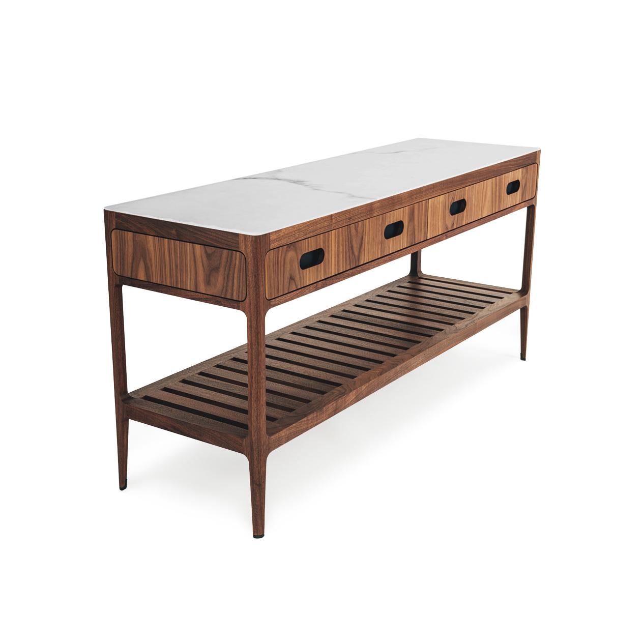 This modern walnut console table designed and fabricated by Munson Furniture draws inspiration from midcentury designs and fits beautifully with both traditional and contemporary interiors. See photos for just a few of the many customizable options.