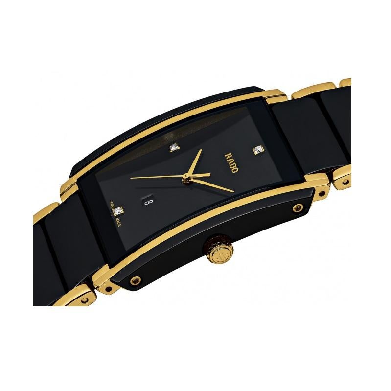 Gold-plated stainless steel case with a yellow gold-plated stainless steel bracelet with black ceramic center links. Fixed black ceramic bezel with yellow gold-plated accents. Black dial with gold-tone hands. Diamonds mark the 3, 6, 9 and 12 o'clock