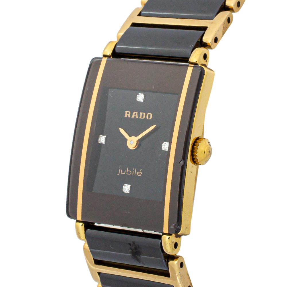 Designed with a modern and high-tech aesthetic, this Rado timepiece is sophisticated and slick. Made from gold-plated stainless steel and titanium, the smooth bezel is coupled with a single glass piece covering the bezel and dial, giving it a