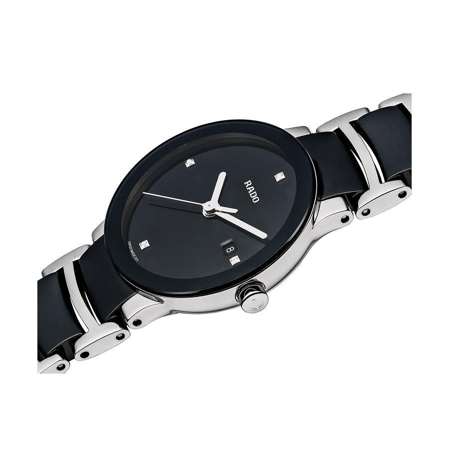 Black ceramic case with a stainless steel bracelet with black ceramic inserts. Fixed black ceramic bezel. Black dial with silver-tone hands. Diamonds mark the 3, 6, 9 and 12 o'clock positions. The Rado name appears below the 12 o'clock position.