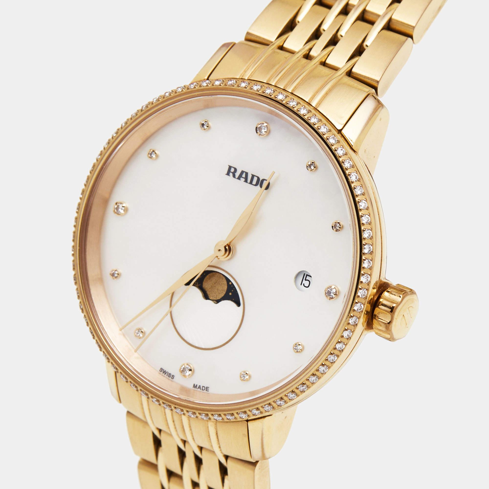 The Rado Coupole R22884923 is an exquisite women's wristwatch. It features a stunning mother-of-pearl dial with diamond hour markers that add a touch of elegance. The watch is beautifully crafted with a rose gold-plated stainless steel case and