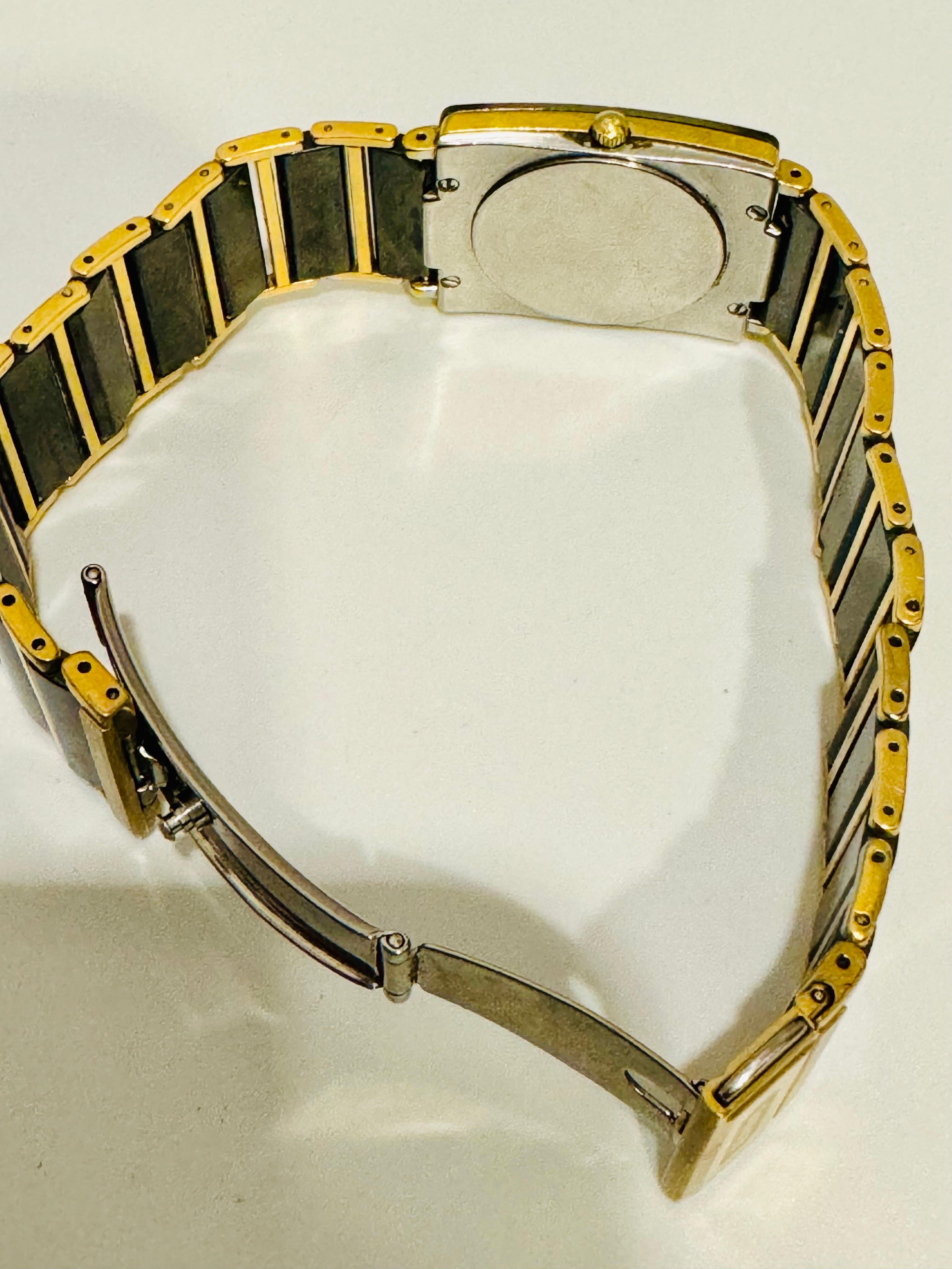 Unisex 
RADO® Watch 
 SCRATCH-PROOF WATER-SEALED BRACELET LINKS IN MICH- TECH CERAMICS
Rectangle
Ceramic
Water Sealed
Black, Gold
-DIA STAR- Pre-owned. An item that has been used previously. The item may

have some signs of cosmetic wear, but is