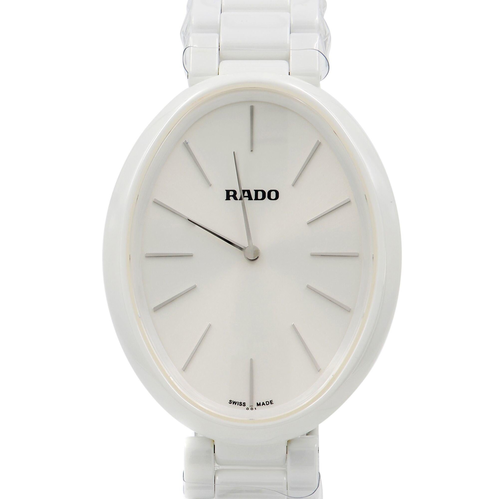 Display Model Rado Esenza R53092012 is a beautiful Ladie's timepiece that is powered by quartz (battery) movement which is cased in a ceramic case. It has a oval shape face, no features dial and has hand sticks style markers. It is completed with a