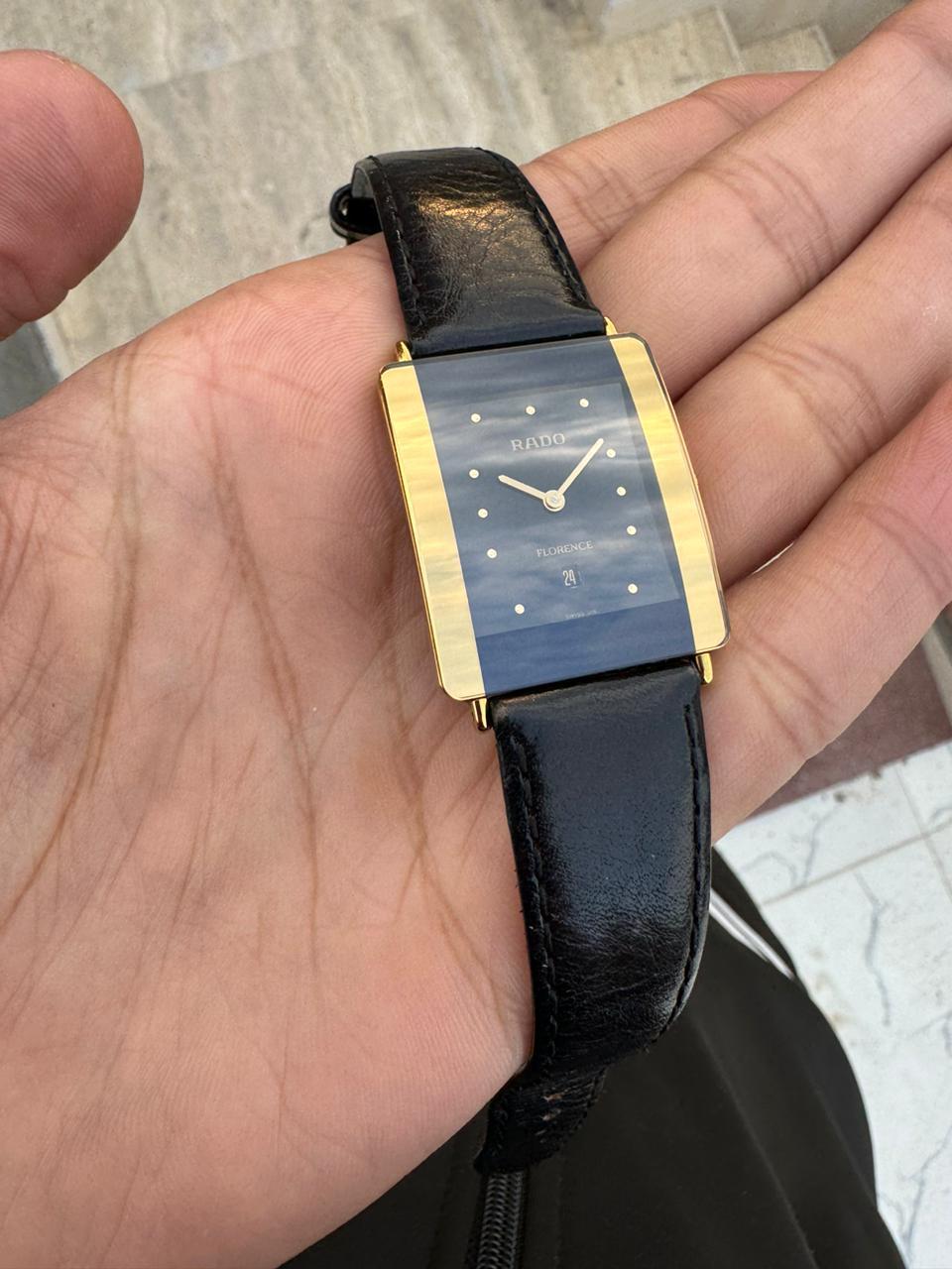 Brand: Rado

Model: Florence

Reference Number:16036702

Country Of Manufacture: Switzerland

Movement: Quartz

Case Material: Stainless steel

Measurements : Case width: 27 mm. (without crown)x 32 mm

Band Type : Black Leather

Band Condition : In