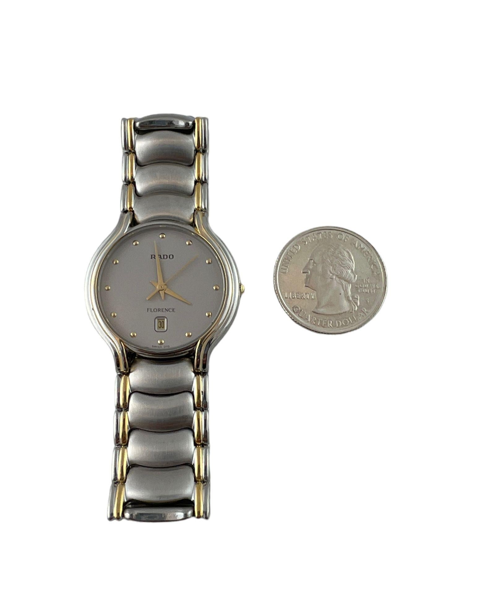 Rado Florence Two Tone Unisex Watch

Model: 129.3644.4
Serial: 03037930

This Rado watch is from the Florence collection.

32mm stainless steel case

quartz movement

silver color with gold accents

gray dial with gold markers. Date is at the