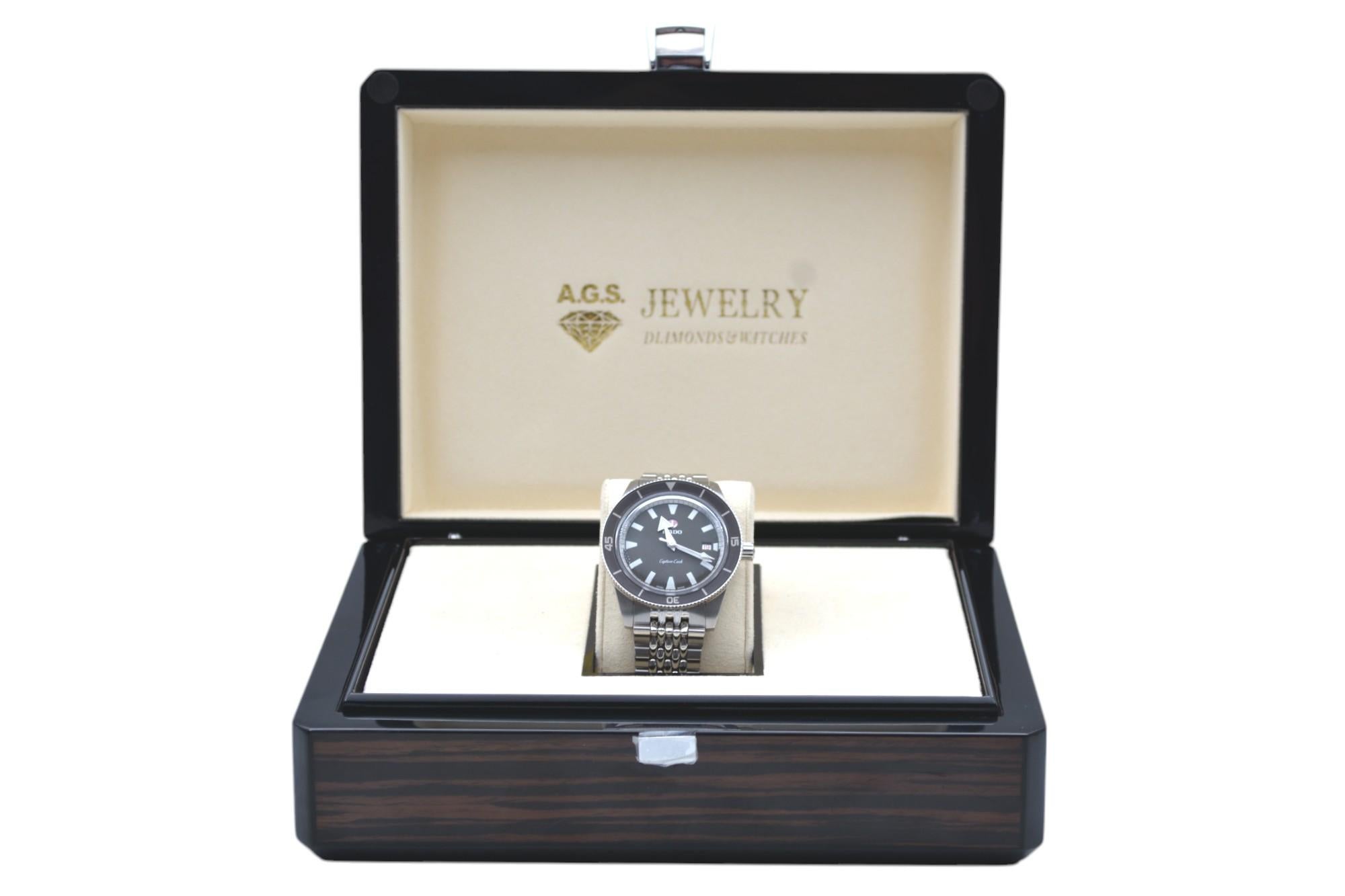 The watch is in a very good condition and it’s working well. It shows slight signs of wear and scratches. The watch comes with an AGS Jewelry wooden box, along with an AGS Jewelry warranty card. For more information about delivery, warranty and
