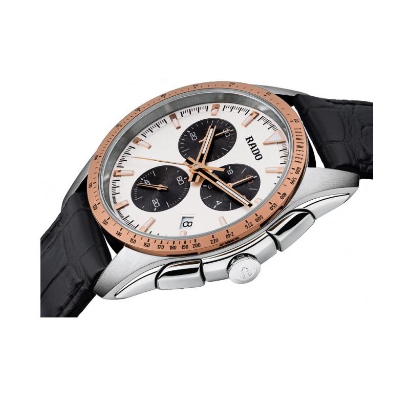 Stainless steel case with a black leather strap. Fixed rose gold-tone bezel. Silver dial with luminous rose gold-tone hands and index hour markers. Minute markers around the outer rim. Dial Type: Analog. Luminescent hands and markers. Date display