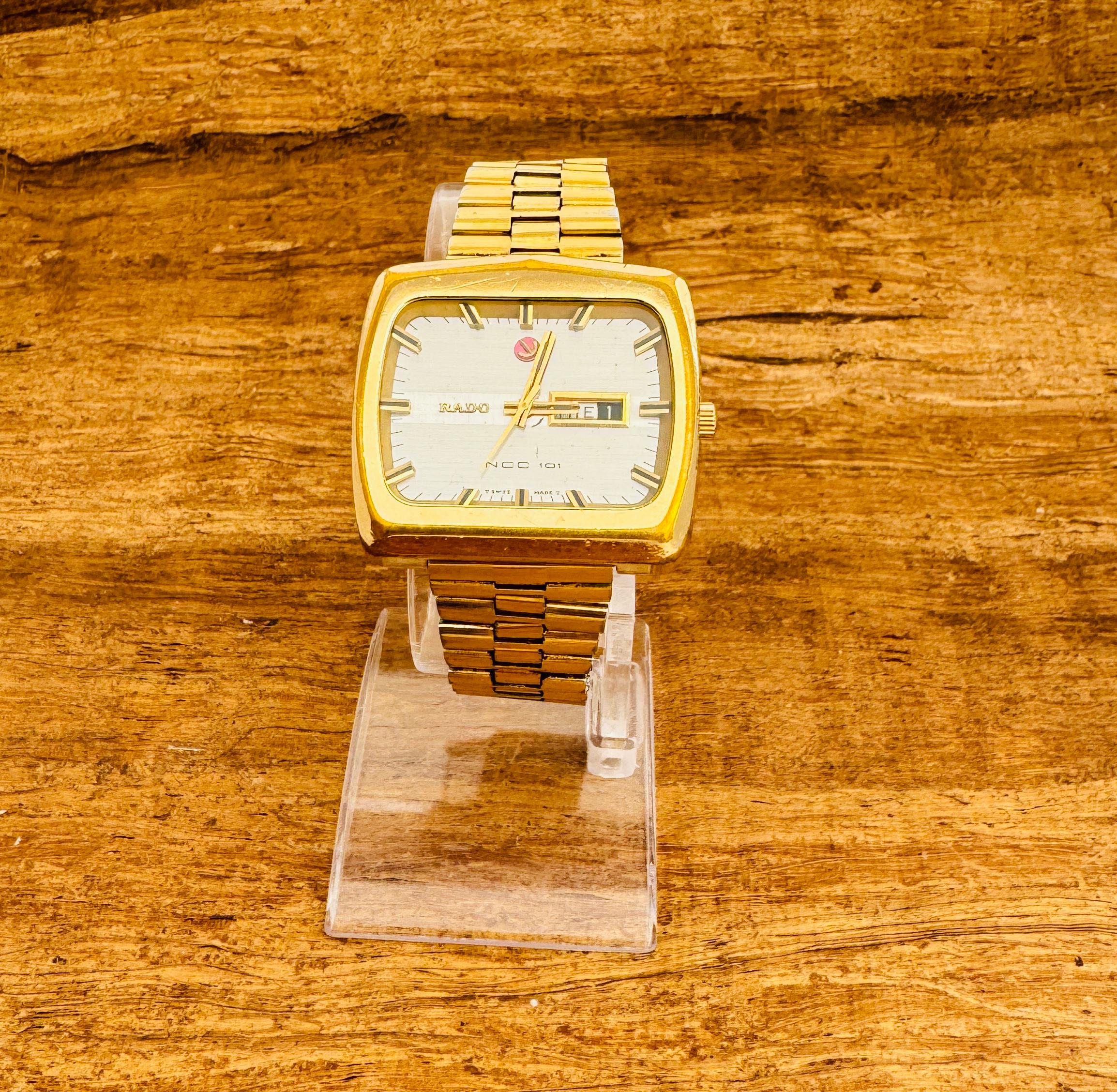    Description
Brand: Rado

Model: NCC101

Reference Number: 11945

Country Of Manufacture: Switzerland

Movement: Automatic

Case Material: Gold Plated Stainless steel

Measurements : Case width: 42 mm. (without crown)

Band Type : Gold Plated