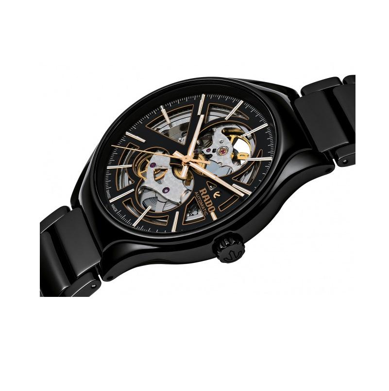 Black high-tech ceramic case with a black high-tech ceramic bracelet. Fixed black high-tech ceramic bezel. Black/skeleton dial with rose gold-tone hands and index hour markers. Dial Type: Analog. Automatic movement. Scratch resistant sapphire
