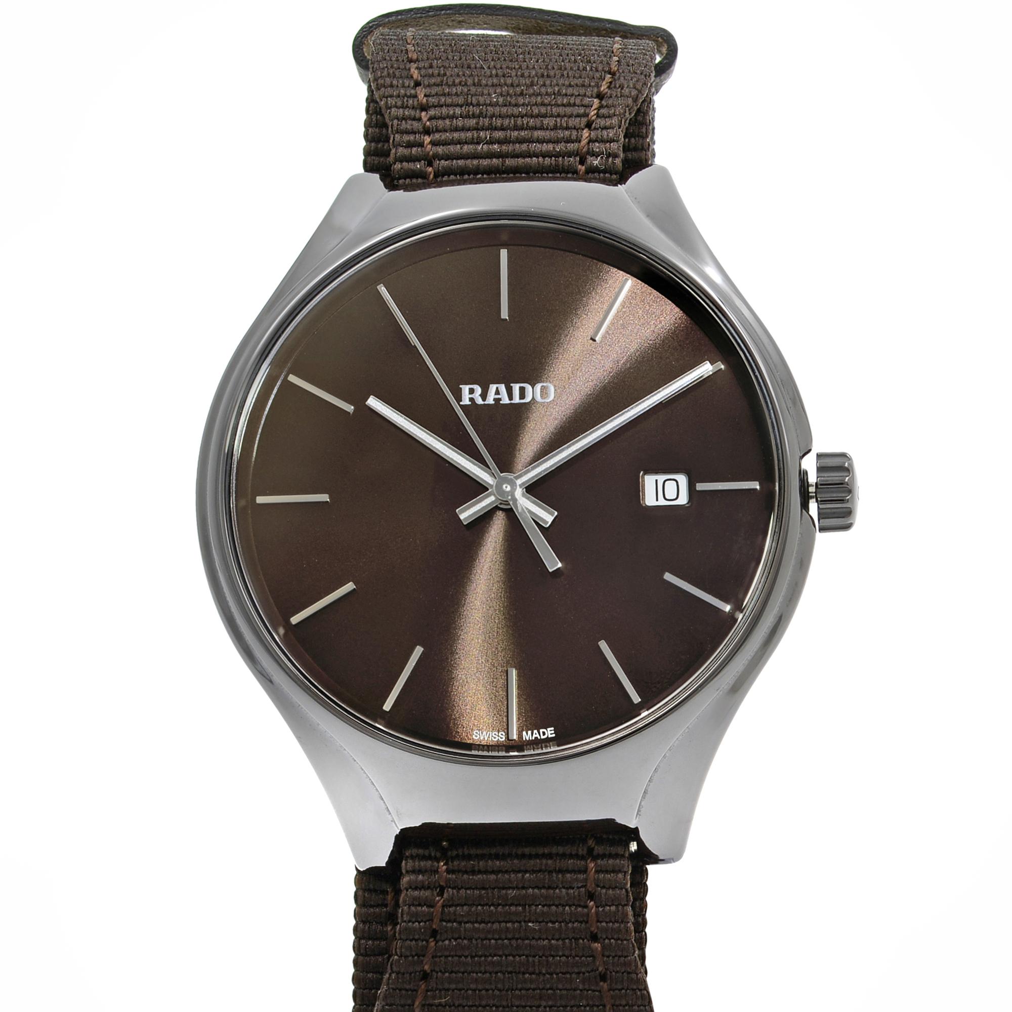 This brand new Rado True R27234306 is a beautiful men's timepiece that is powered by a quartz movement which is cased in a ceramic case. It has a round shape face, date dial and has hand sticks style markers. It is completed with a fabric/canvas