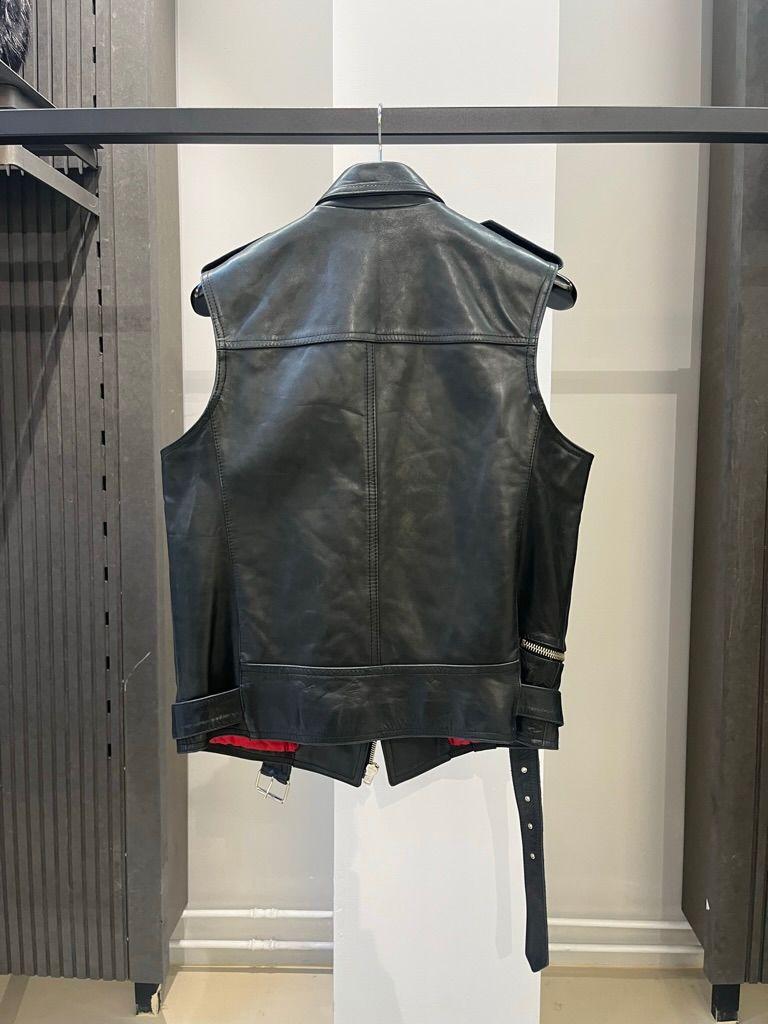 Raf By Raf Simons
2006 Perfecto Leather Riders Vest
Size 48

Beautiful Raf by Raf Simons perfecto riders vest in a size 48. Absolutely stunning piece that's very hard to come by. Features different details such as multiple zippers, a cargo pocket