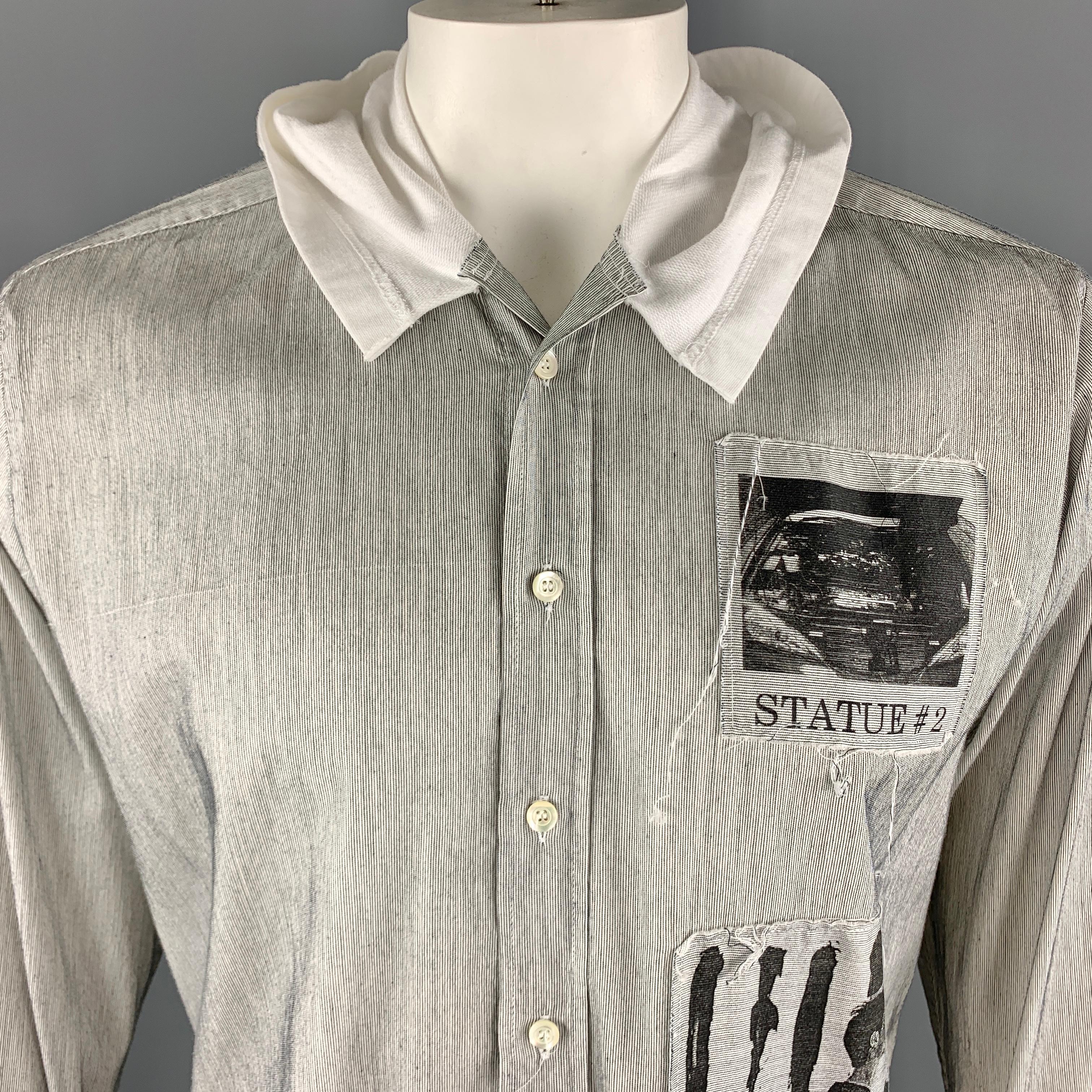 RAF by RAF SIMONS Long Sleeve Shirt comes in black and white pinstripe cotton material, featuring a white hood, a buttoned front, graphics at patches, a Statue # 2 graphic, and buttoned cuffs. Made in Italy.

Excellent Pre-Owned Condition.
Marked: