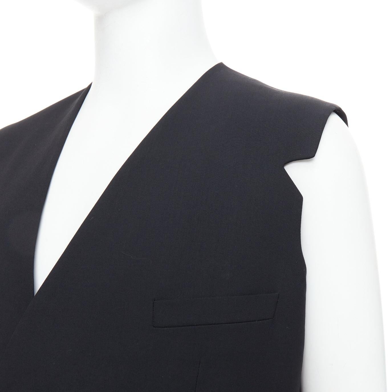 RAF SIMONS 2009 black 100% wool v cut armhole waistcoat IT52 XL
Reference: PRWU/A00122
Brand: Raf Simons
Designer: Raf Simons
Collection: SS 2009
Material: Wool
Color: Black
Pattern: Solid
Closure: Button
Lining: Black Fabric
Extra Details: V cut at