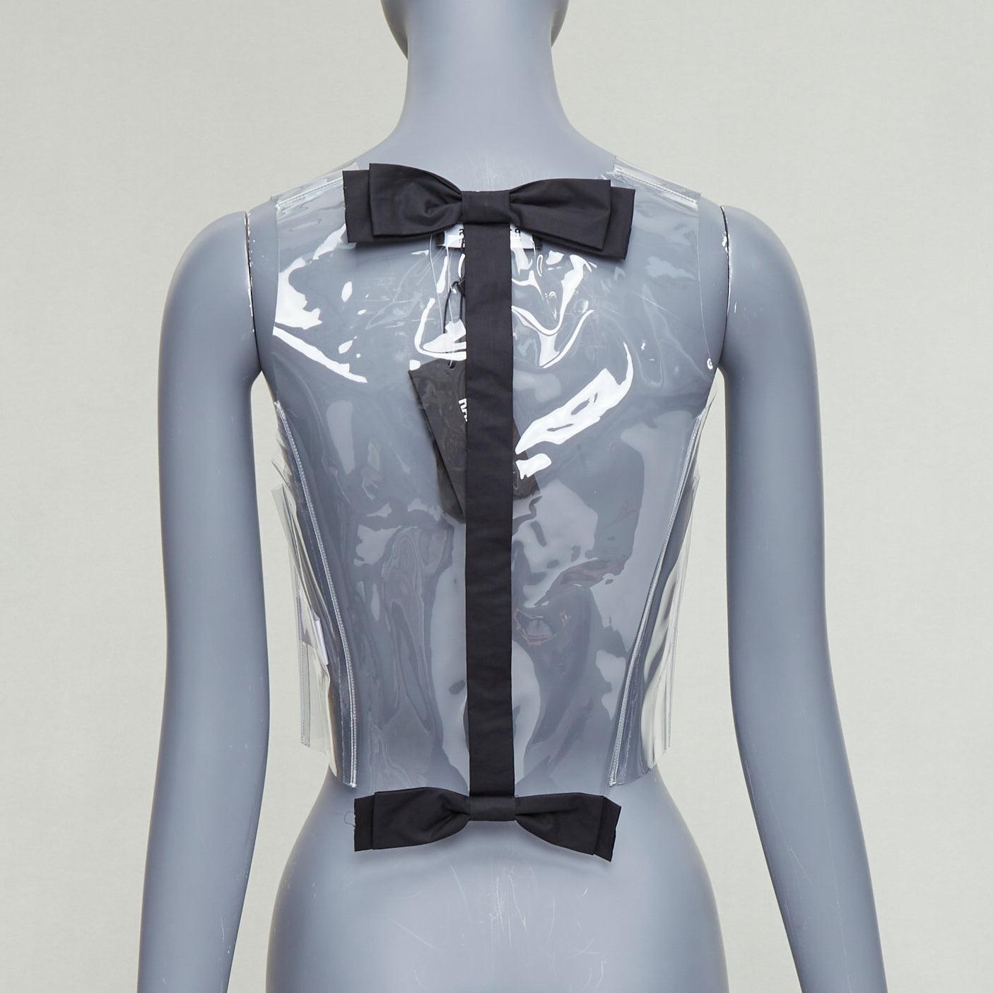 RAF SIMONS 2021 clear PVC black cotton bow snap buttons gilet vest FR34 XS
Reference: TGAS/E00418
Brand: Raf Simons
Designer: Raf Simons
Collection: SS 2021 - Runway
Material: Cotton, PVC
Color: Clear, Black
Pattern: Solid
Closure: Snap