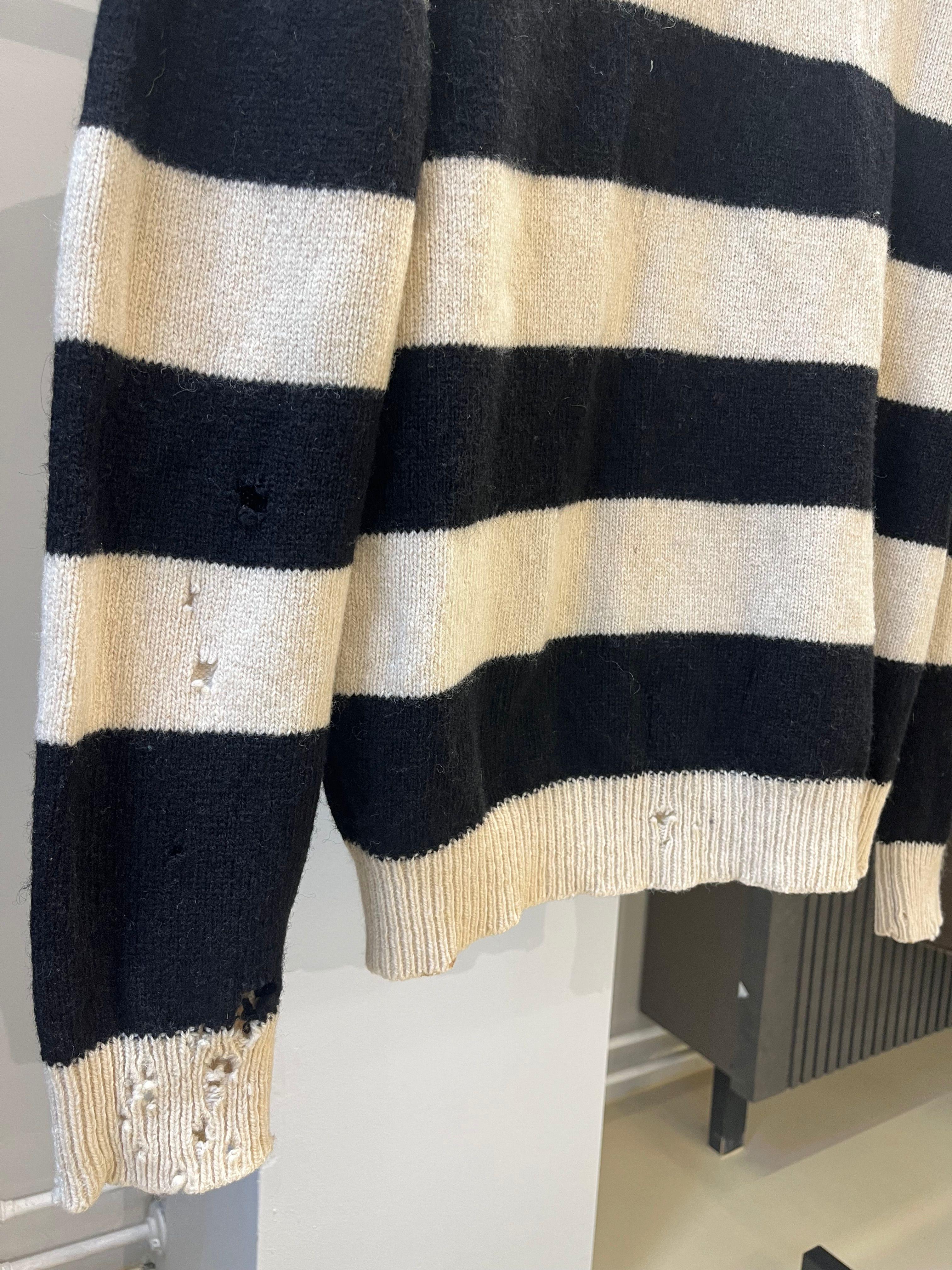 Raf Simons
AW 2001 Riot Riot Riot Distressed Knit Sweater
Size 52

Beautiful Raf Simons distressed knit sweater from his famous 2001 autumn winter collection 'Riot Riot Riot'. Very rare distressed version, in great condition please refer to the