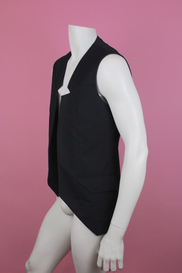 -Vest with interesting neckline details from Raf Simons Spring Summer 2009
-Outer is 100% cotton, lining is viscose 
-Great piece to throw on and style with any outfit
-Made in Belgium
-Sized IT 50 / US 40 

Approximate Measurements 
-Length: