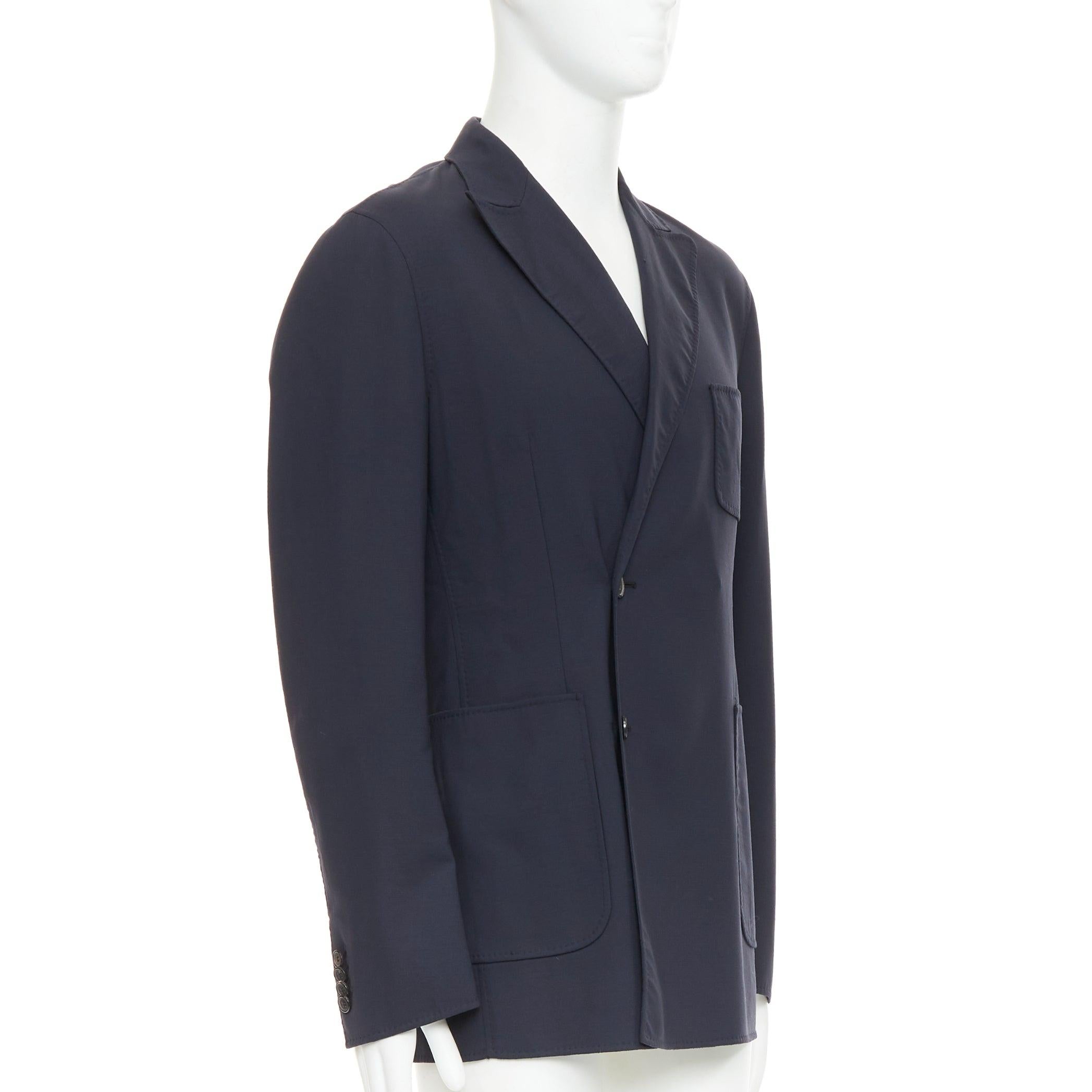 RAF SIMONS blazer largo de lana virgen negra con botones descentrados y bolsillo de parche IT48 M Negro en venta