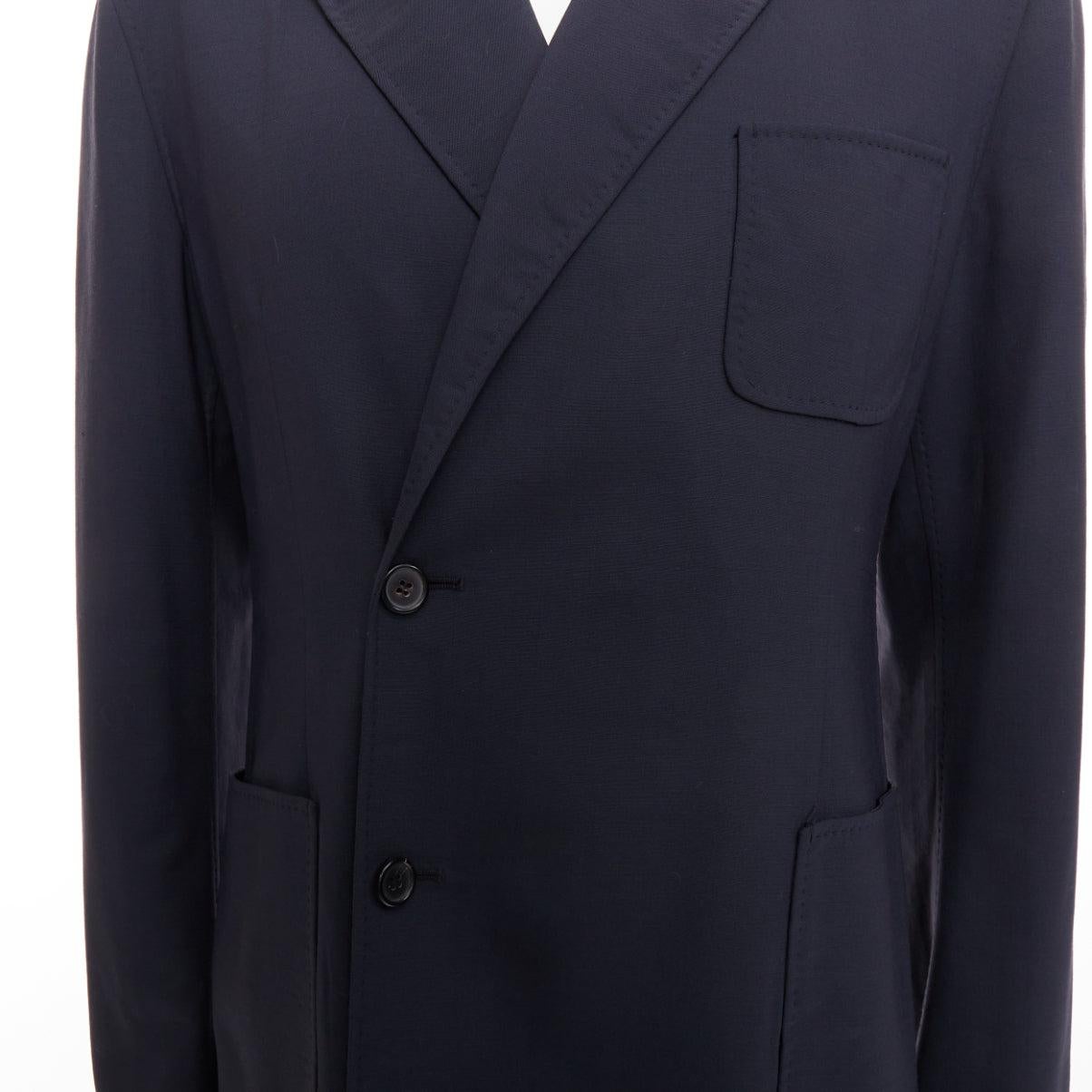 RAF SIMONS blazer largo de lana virgen negra con botones descentrados y bolsillo de parche IT48 M en venta 2