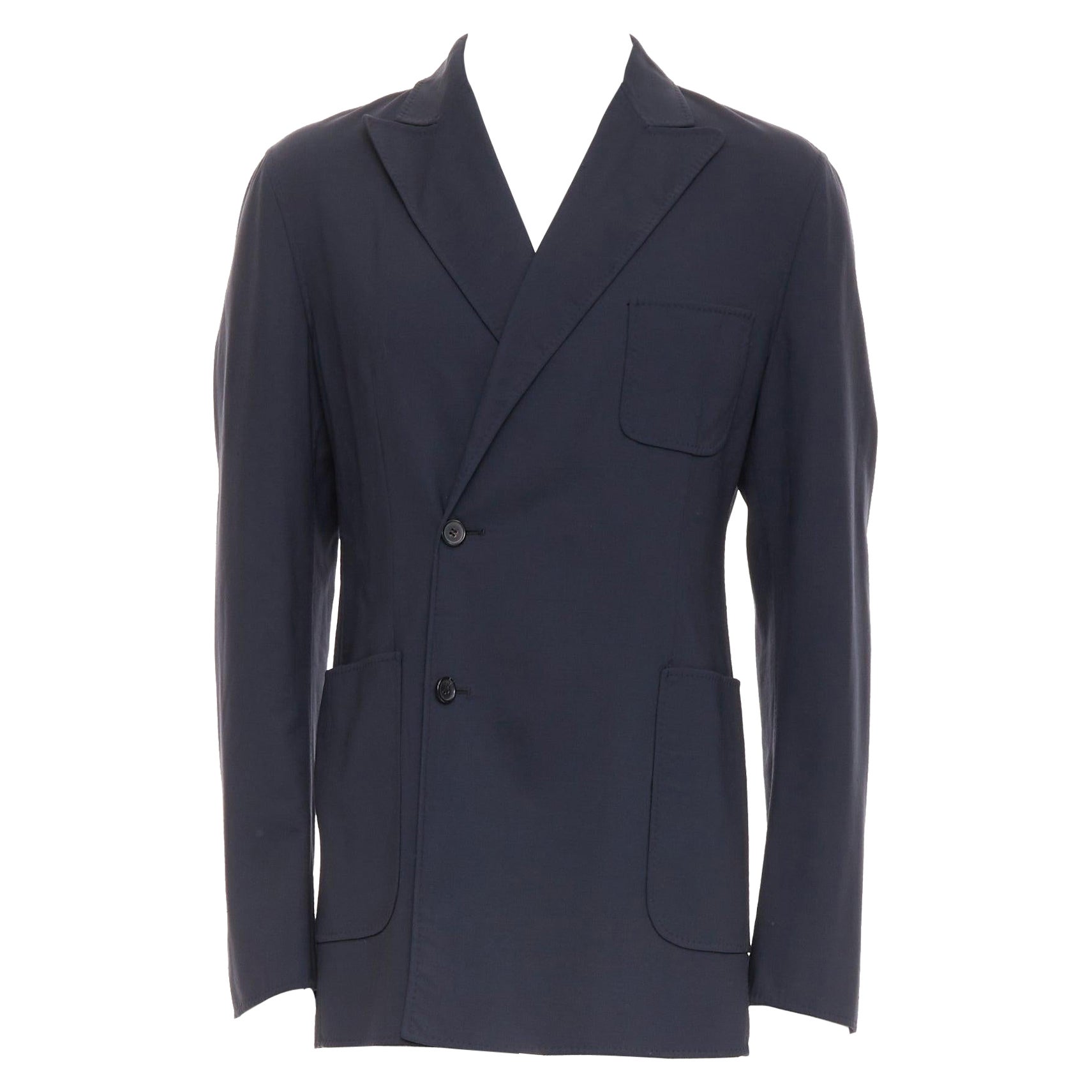 RAF SIMONS blazer long en laine vierge noire à boutons décentrés et poches plaquées IT48 M