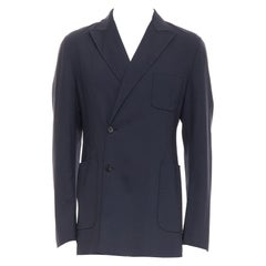 RAF SIMONS blazer long en laine vierge noire à boutons décentrés et poches plaquées IT48 M