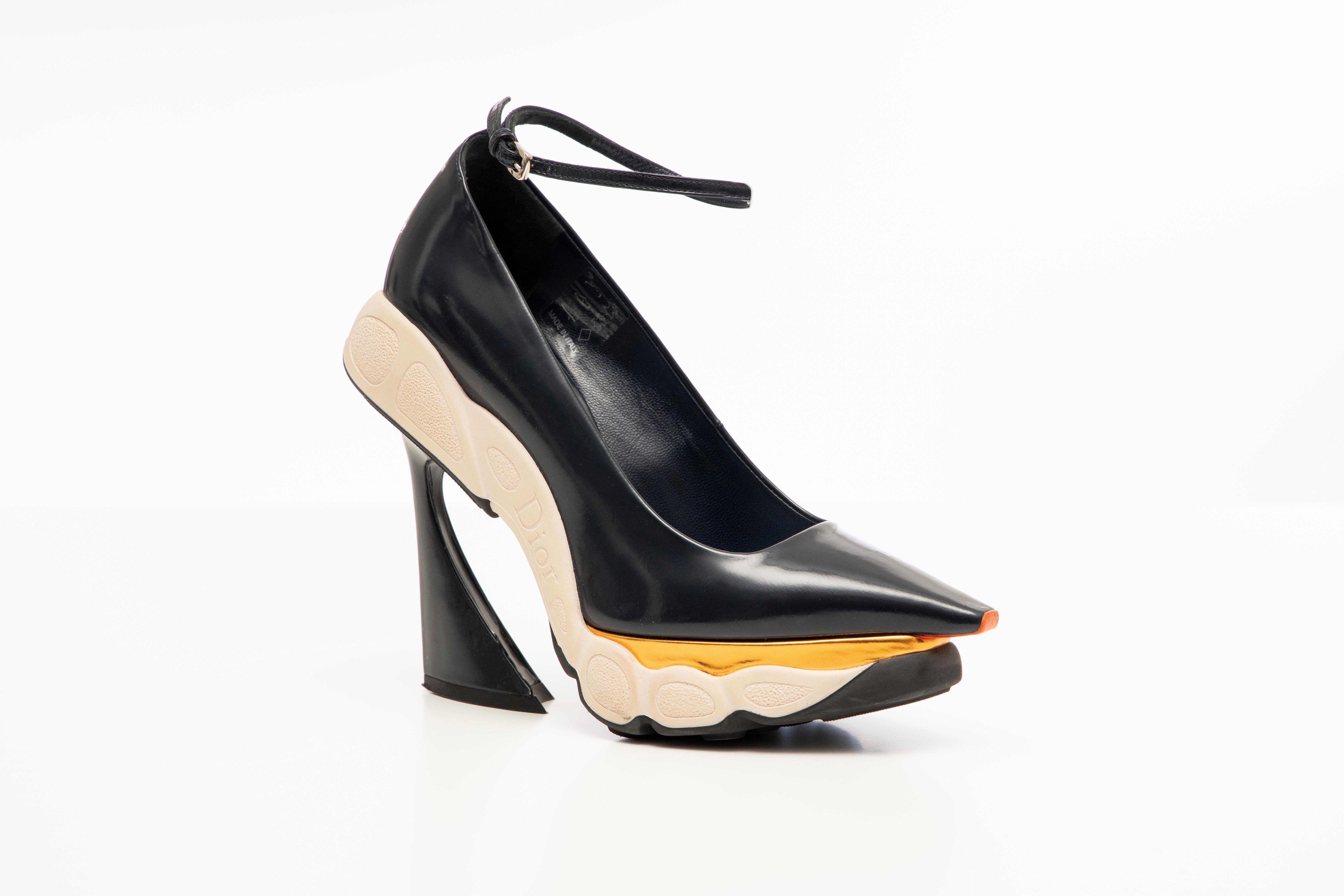 Raf Simons for Christian Dior, Fall 2014, navy blue, patent leather, pointed-toe runway sneaker pumps with copper-tone metallic leather accents, rubber soles, covered heels with ankle straps.

IT. 36
US. 6

Heels: 4.25