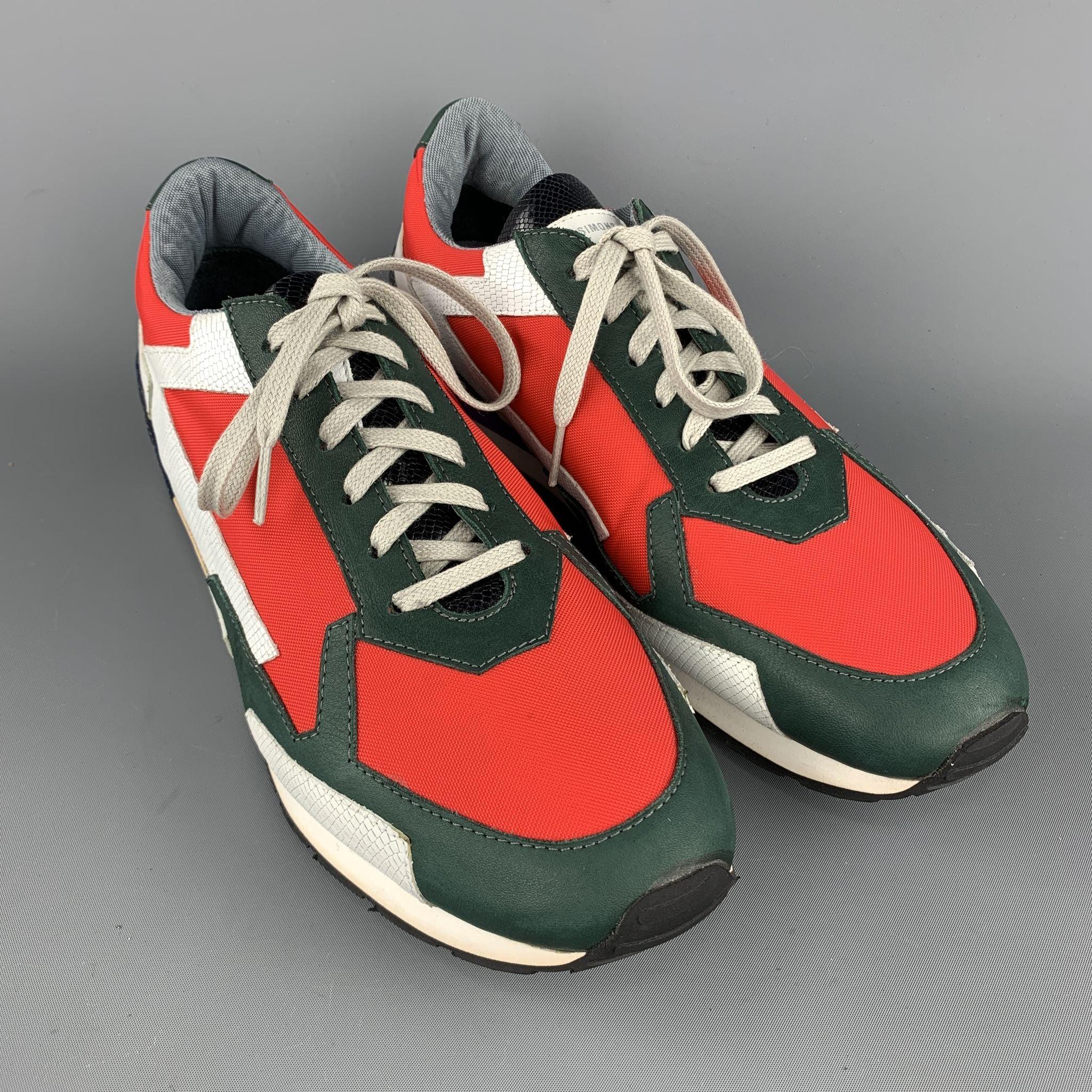 RAF SIMONS sneakers comes in a multi-color nylon featuring black and white leather trim details and a purple trim rubber sole. Made in Italy.Very Good Pre-Owned Condition. 

Marked:   43 

Measurements: 
  Outsole: 11.5 in x 4 inches 
  
  

