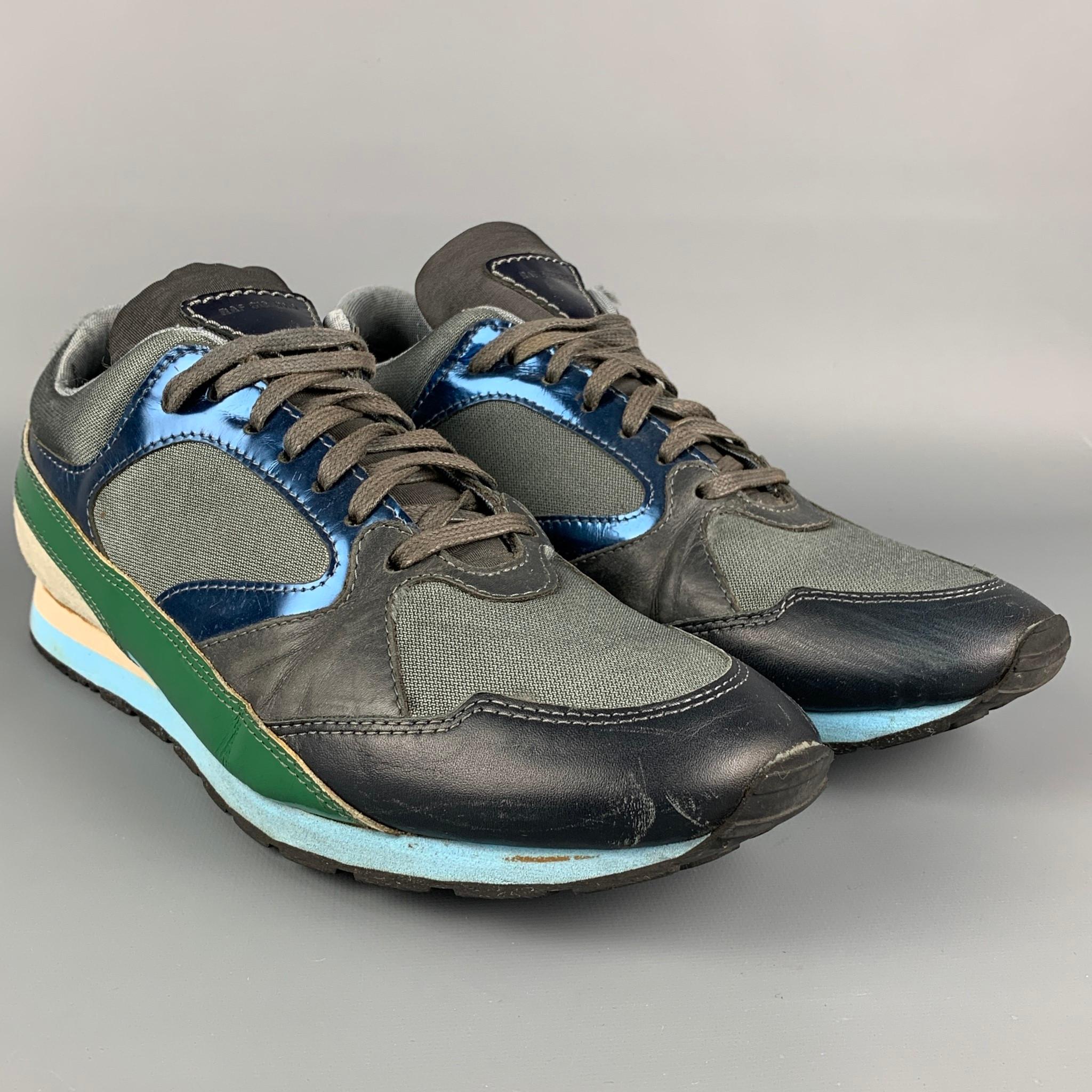 RAF SIMONS sneakers comes in a multi-color nylon featuring a color block style, leather trim, rubber sole, and a lace up closure. 

Good Pre-Owned Condition.
Marked: 13516 44

Outsole: 12.25 in. x 4 in. 