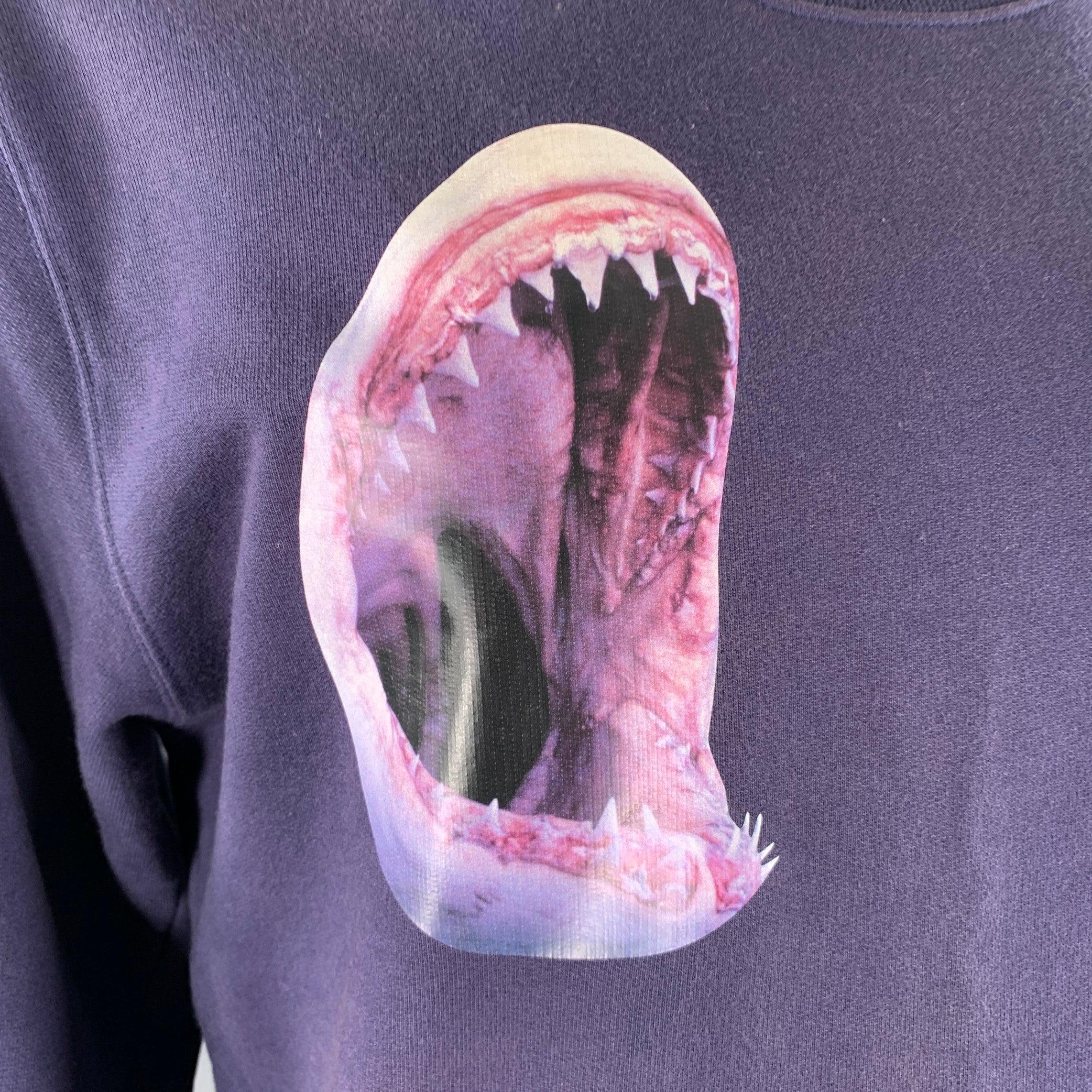RAF SIMONS x STERLING RUBY sweatshirt
in a
navy cotton knit featuring a shark print, orange and black 
