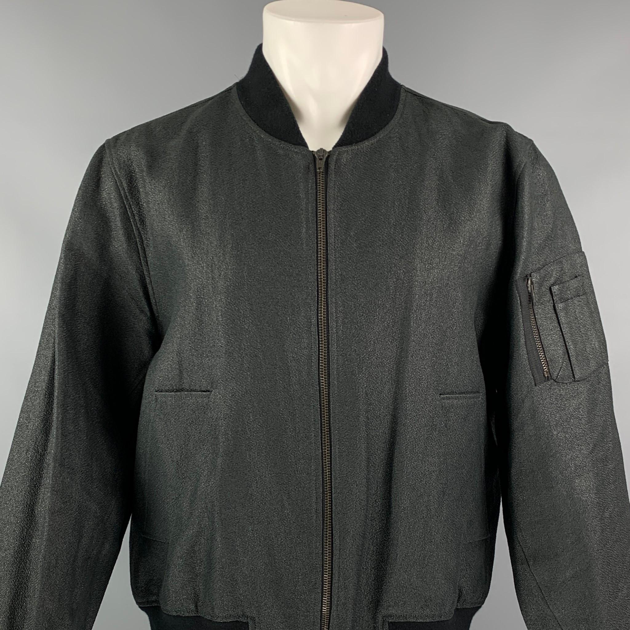 Raf Simons Black Bomber Jacket from the Spring/Summer 2009 menswear collection. Features dual welt pockets at front, zip pocket at sleeve, woven lining and zip closure at center front. Made in Belguim.

Excellent Pre-Owned Condition. No visible