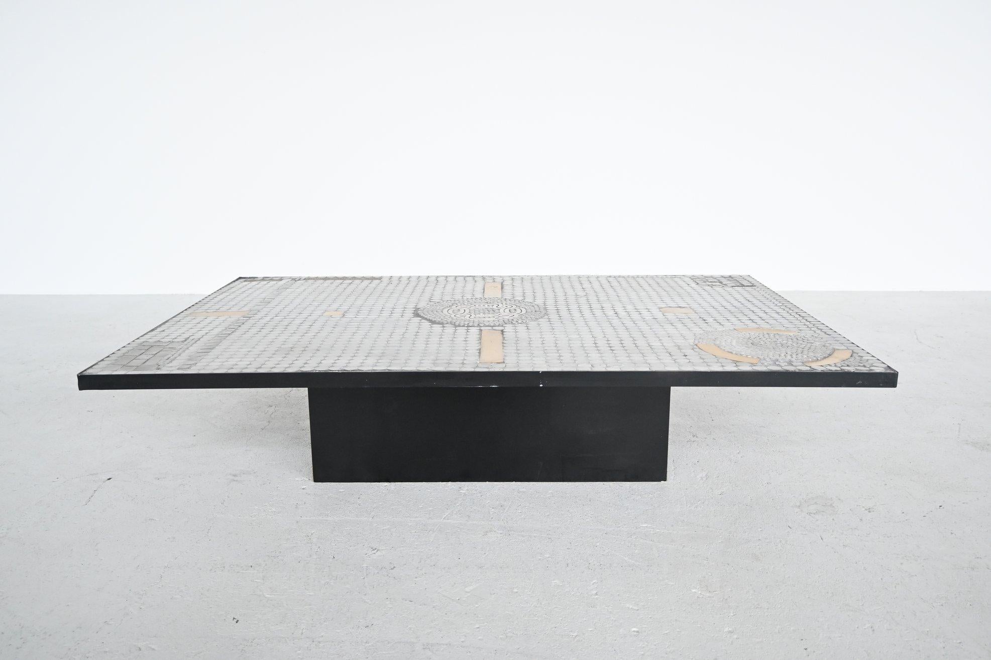 Beautiful handcrafted coffee table designed by Raf Verjans and manufactured in his own atelier in Belgium, 1970. This table has a black laminated base and is completely inlayed with aluminum and brass mosaic details which gives a great look. Raf