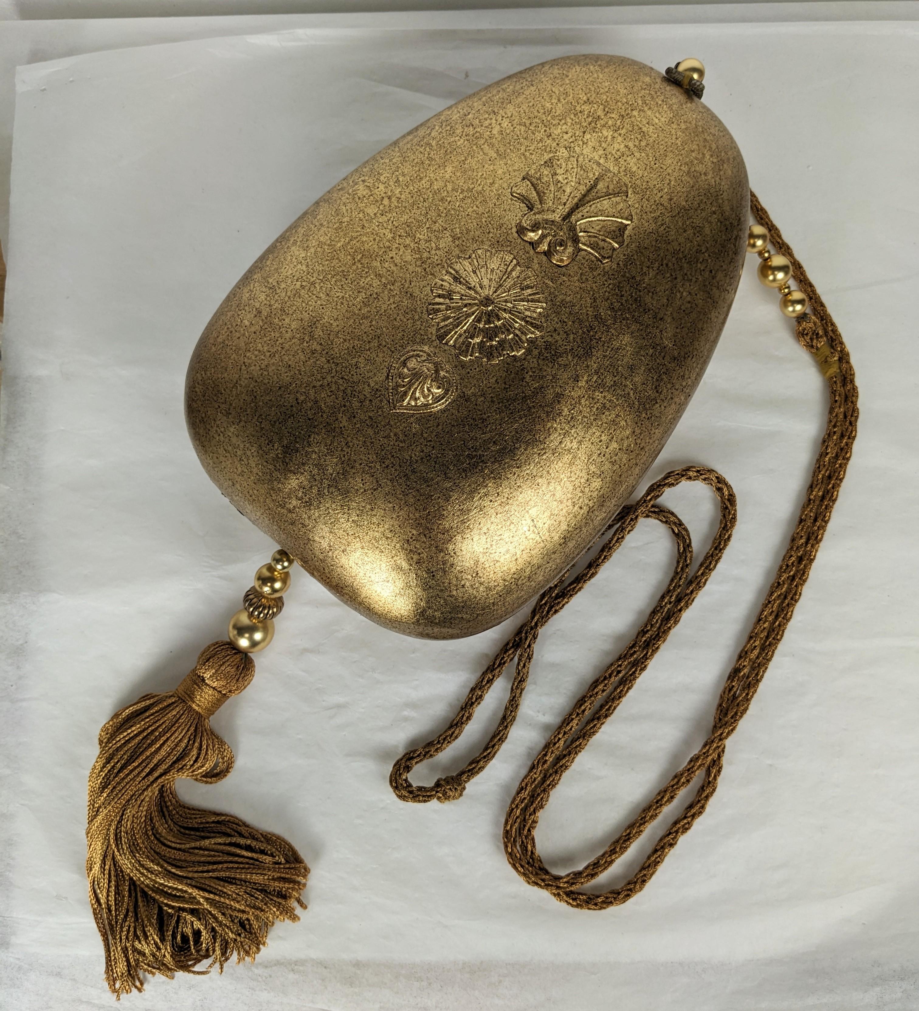 Rafael Sanchez Gold Leaf Egg Minaudiere, on carved wood base with decorative gilt motifs. Asian overtones with the braided gold silk cording and tassel mixed with glass and gold beads. Special Disco era day/evening novelty purse from a famed
