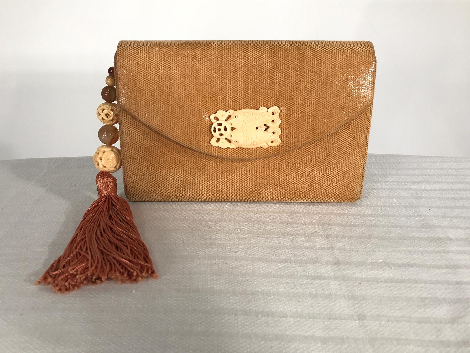 Rafael Sanchez golden honey comb suede, beaded tassel shoulder bag from the 1980s. Textured suede through a magnifying glass it looks like honey comb. Boxy shoulder bag, will hold an iPhone and more. Braided ivory/gold cord shoulder strap. Carved