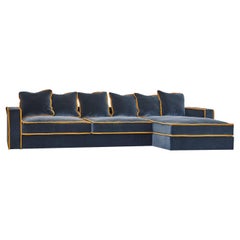 Sofá angular de terciopelo azul oscuro y amarillo Rafaella Bio by Biosofa