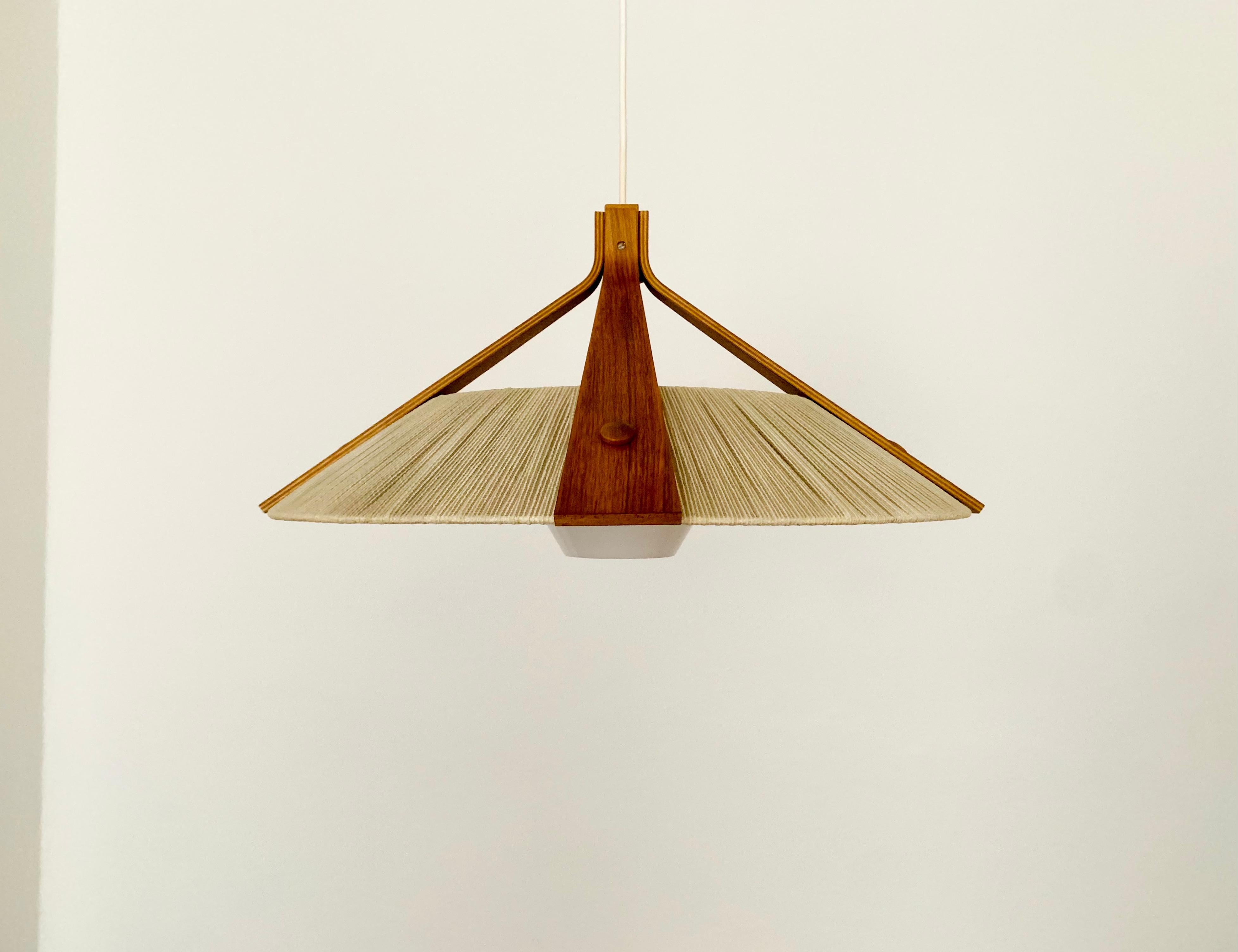 Exceptionally beautiful and large pendant light from the 1960s.
The design is very unusual.
The shape and the materials create a warm and very pleasant light.

Condition:

Very good vintage condition with slight signs of wear consistent with
