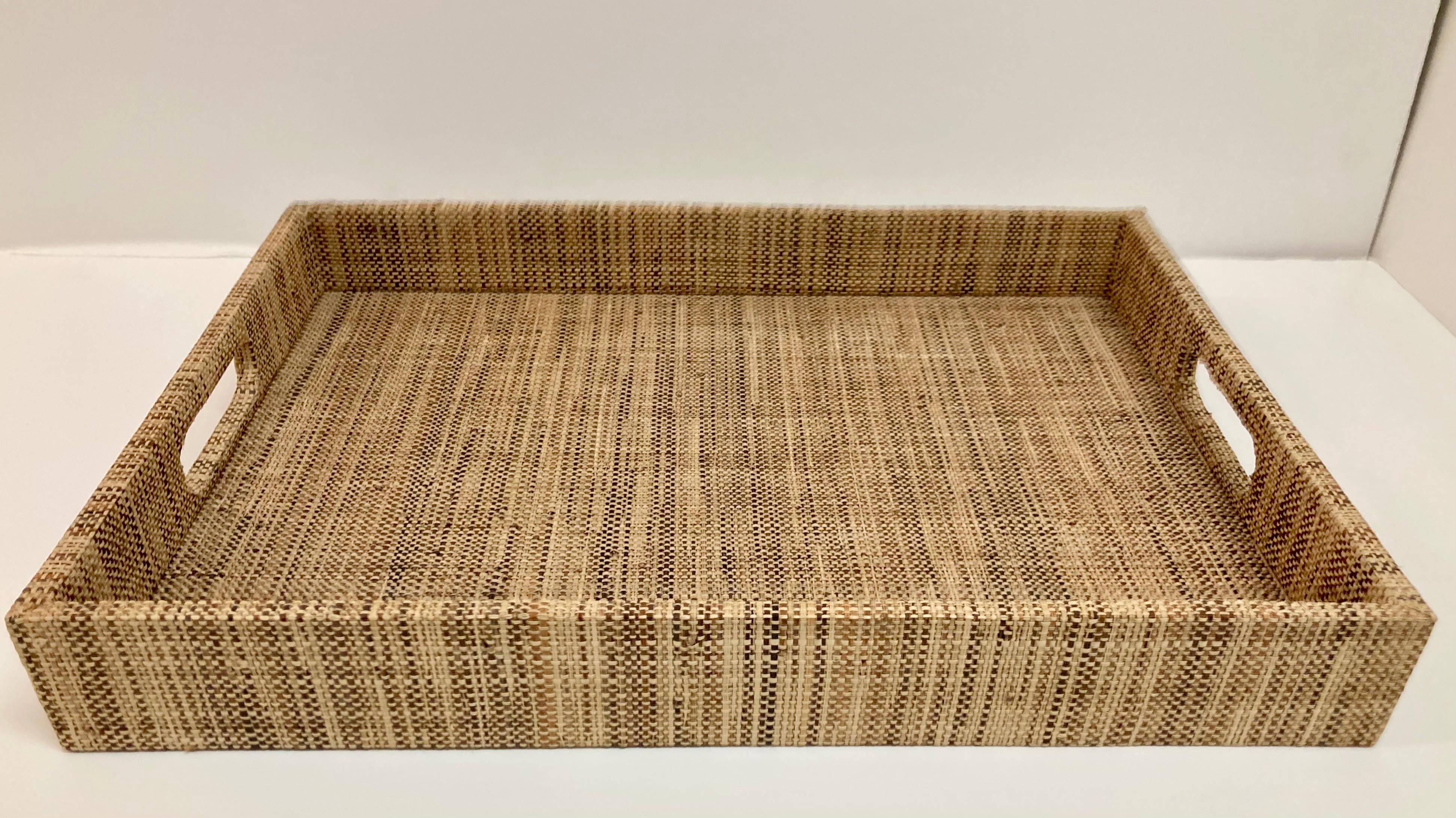 Raffia covered serving tray in a modern form. Very handsome and classic details. Perfect for bedtime treats.