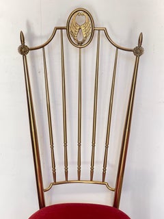 An elegant pair of chairs in brass and red velvet, "Palazzo Reale," 1970s