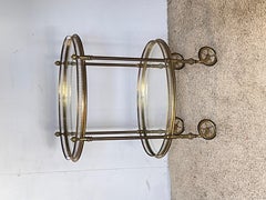 Elegant oval bar cart in gilded brass with double glass shelves, 1970