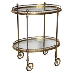 Elegant oval bar cart in gilded brass with double glass shelves, 1970