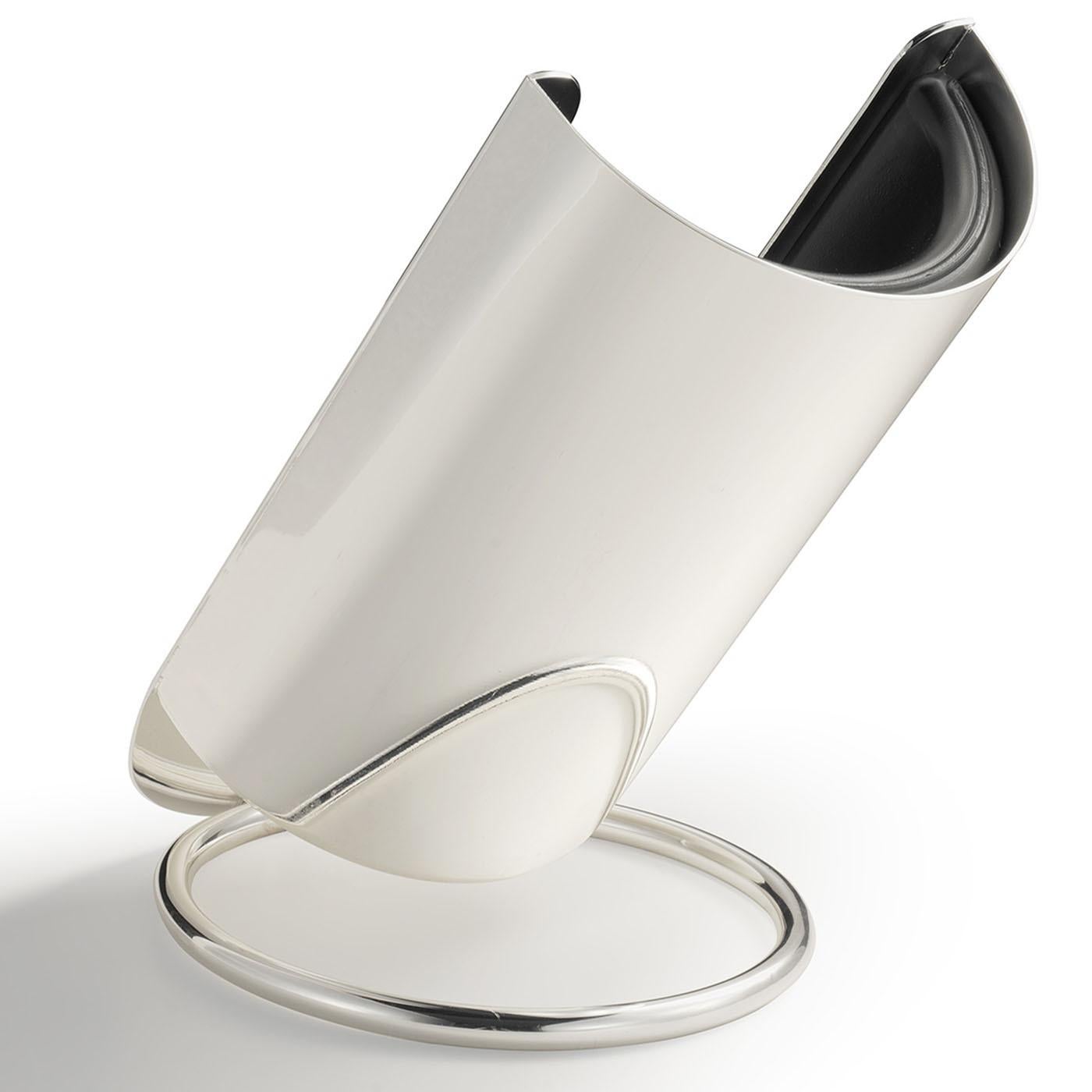 Superb for displaying bottles for special occasions, this exceptional bottle holder is the perfect addition to dining decors. The ringed base with a satin silver finish supports the half-moon shell, cooling your beverage while also exposing the