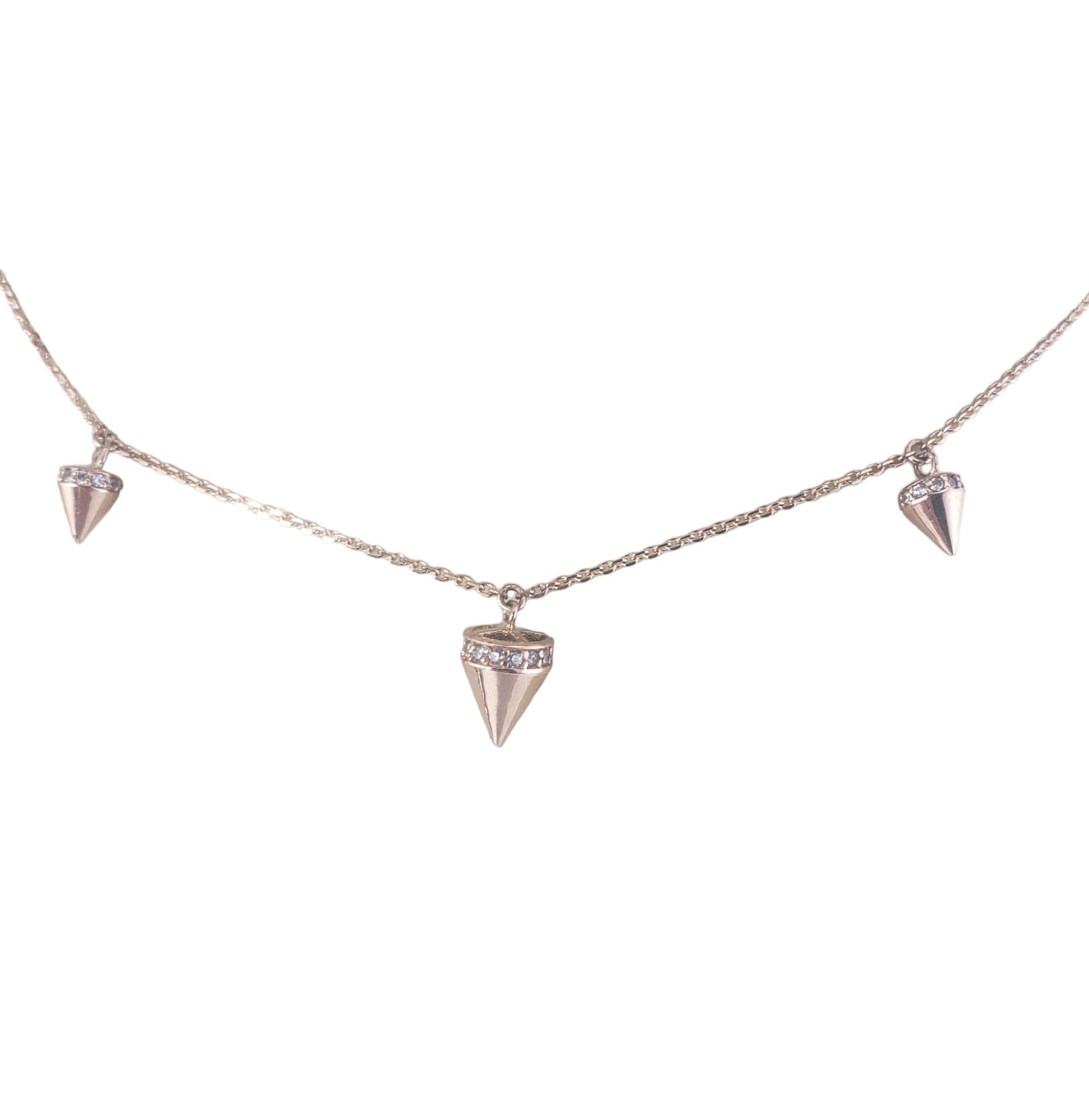 Rafinity 18 Karat Rose Gold Station Necklace-

This lovely station necklace is accented with cubic zirconia stones set in beautifully detailed 18K rose gold.

Size: 15.5 inches

Hallmark: RAFINITY  750

Weight: 3.7 dwt./ 5.9 gr.

Very good