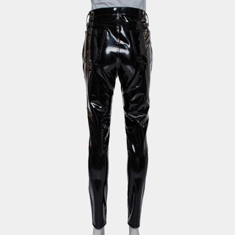 A fashionable pair of fitted pants for women by rag & bone. Made from synthetic fabric, the glossy pair of pants feature five pockets, front zip-button closure, and a statement look.

