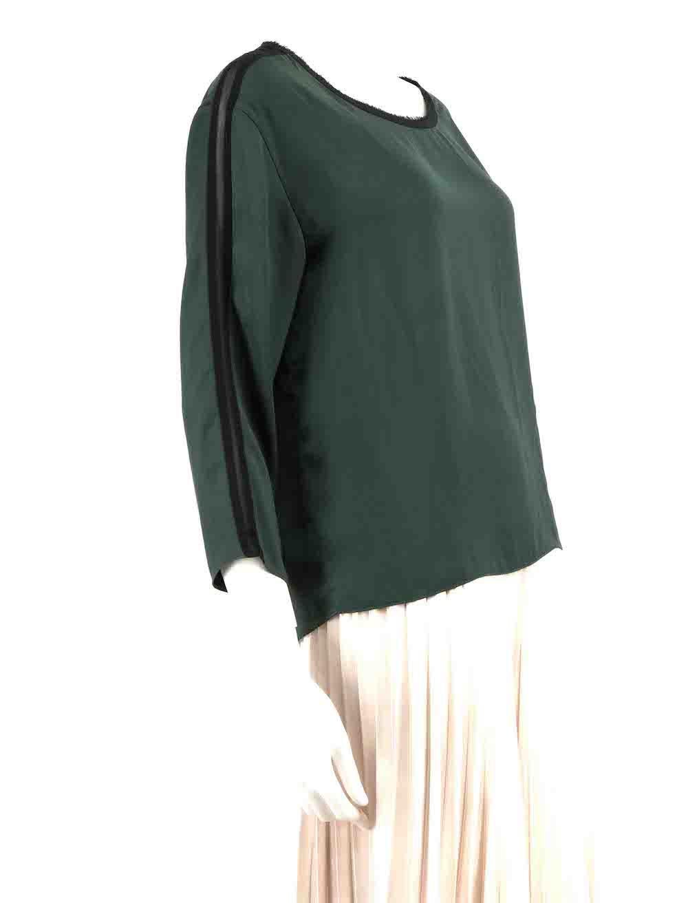 CONDITION is Good. Minor wear to top is evident. Light wear to the front with plucks to the weave on this used Rag & Bone designer resale item.
 
 Details
 Green
 Polyester
 Blouse
 Black raw edge trim
 Long sleeves
 Round neck
 
 
 Made in USA
 
