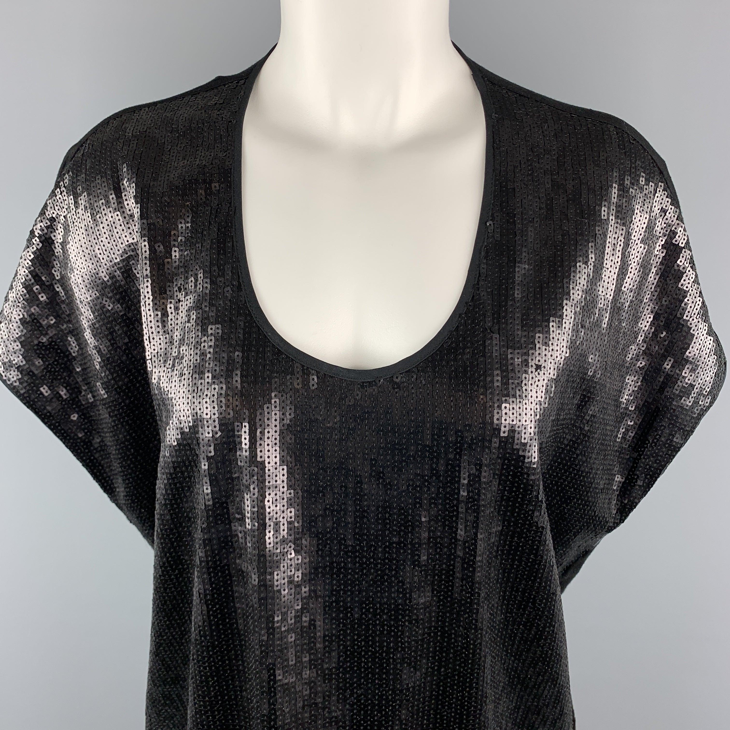 RAG & BONE Tunic dress comes in black tones in a sequined and Lyocell blend materials, with a round neck, sleeveless, a sequined front, seam pockets at sides, and a draped effect at back. Made in USA.Very Good
Pre-Owned Condition. 

Marked:   0