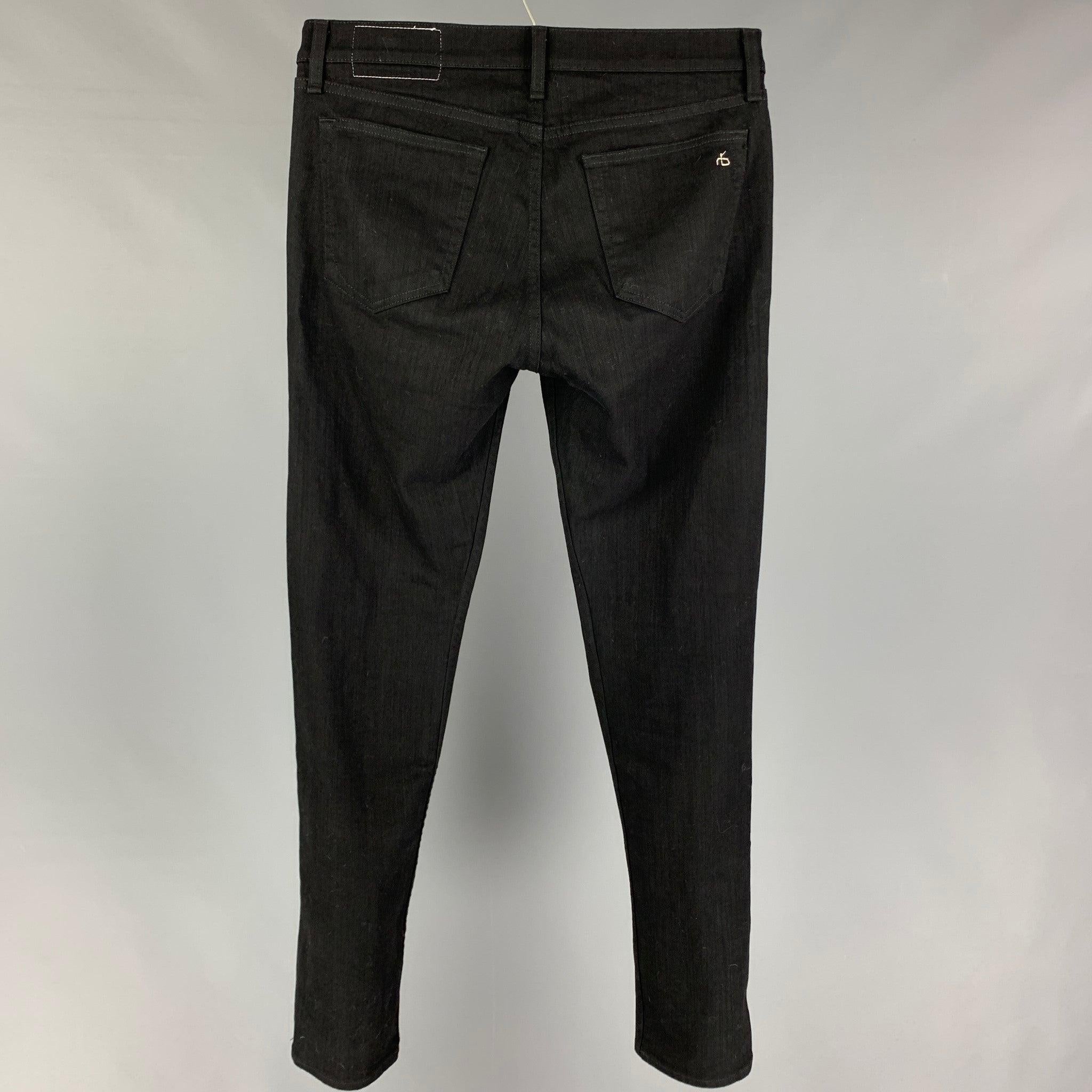 RAG & BONE jeans comes in a black cotton / polyurethane featuring a slim fit and a button fly closure.
Very Good
Pre-Owned Condition. 

Marked:   31  

Measurements: 
  Waist: 32 inches  Rise: 10 inches  Inseam: 34 inches 
  
  
 
Reference: