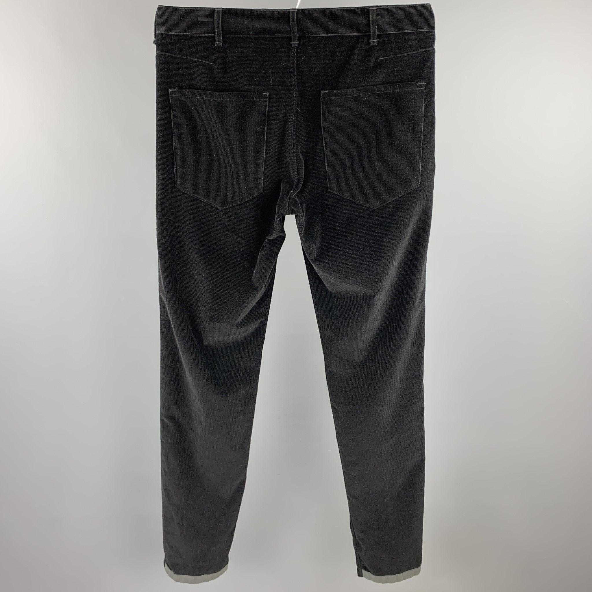 RAG & BONE casual pants comes in a black corduroy with a gray trim featuring a slim fit and button fly closure.Excellent
Pre-Owned Condition. 

Marked:   32 

Measurements: 
  Waist: 32 inches 
Rise: 9.5 inches 
Inseam: 35 inches 
  
  
 
Reference: