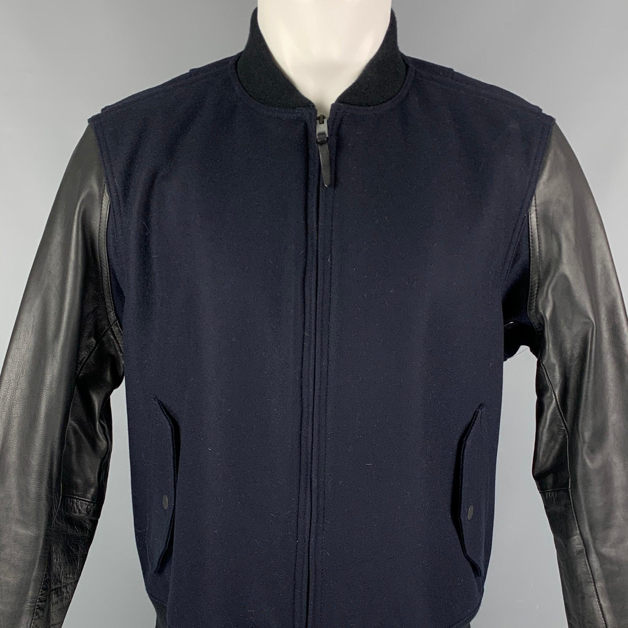 RAG & BONE jacket comes in a navy wool with black leather sleeves featuring a bomber style, ribbed hem. front pockets, and a zip up closure. Made in USA.Very Good
Pre-Owned Condition. 

Marked:   42 

Measurements: 
 
Shoulder: 18.5 inches  Chest: